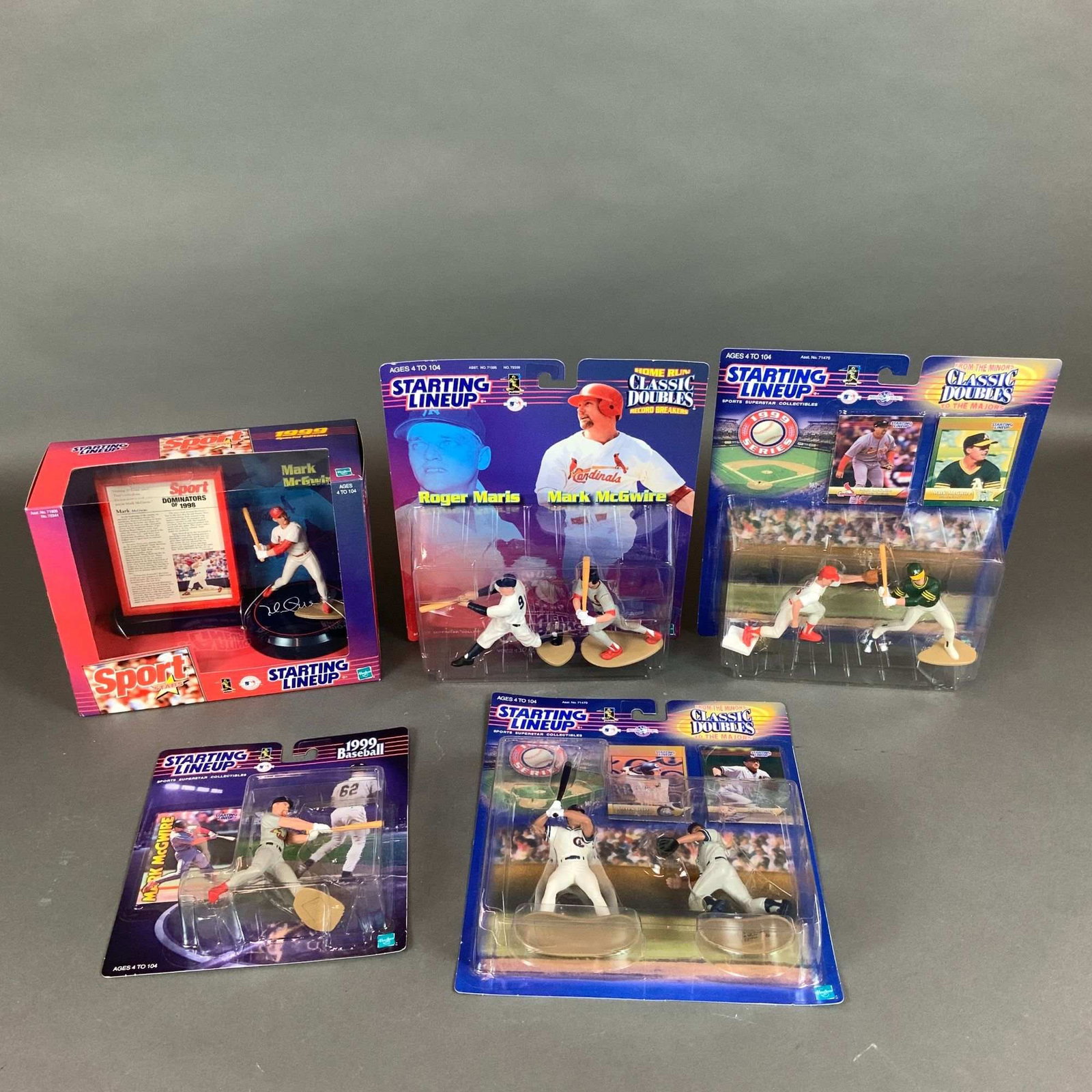 5 Hasbro Starting Lineup Sport Stars MLB Baseball Mark McGwire Action Figures: A collection of 5 unopened Starting Lineup baseball action figure sets produced by Hasbro in 1999. This lot primarily commemorates the career milestones and historic 1998 home run record chase of