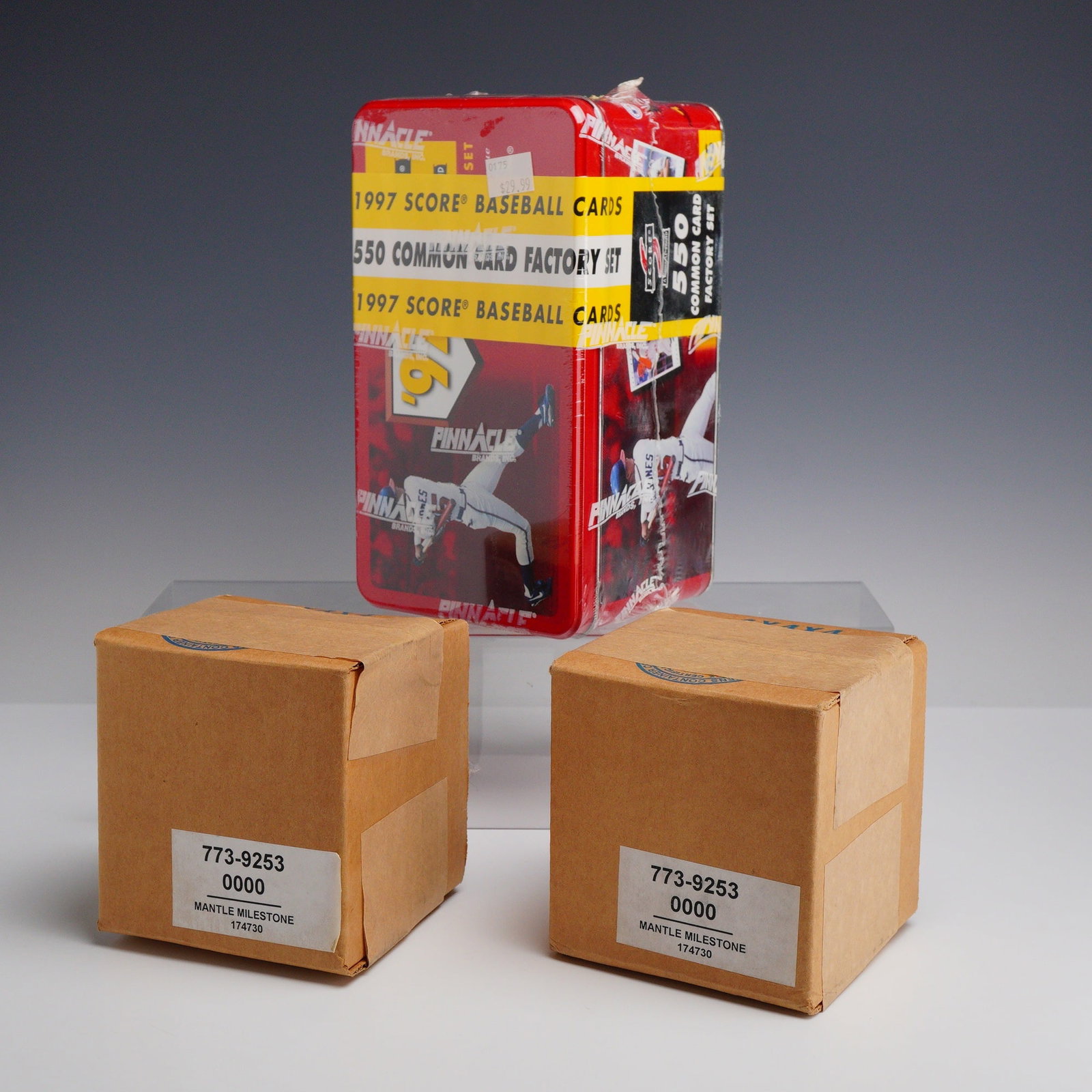 3pc Baseball Card Boxes: This group of sports memorabilia includes a factory-sealed 1997 Score Baseball common card set and two factory-sealed boxes of Mickey Mantle milestone cards. The card set is contained within a