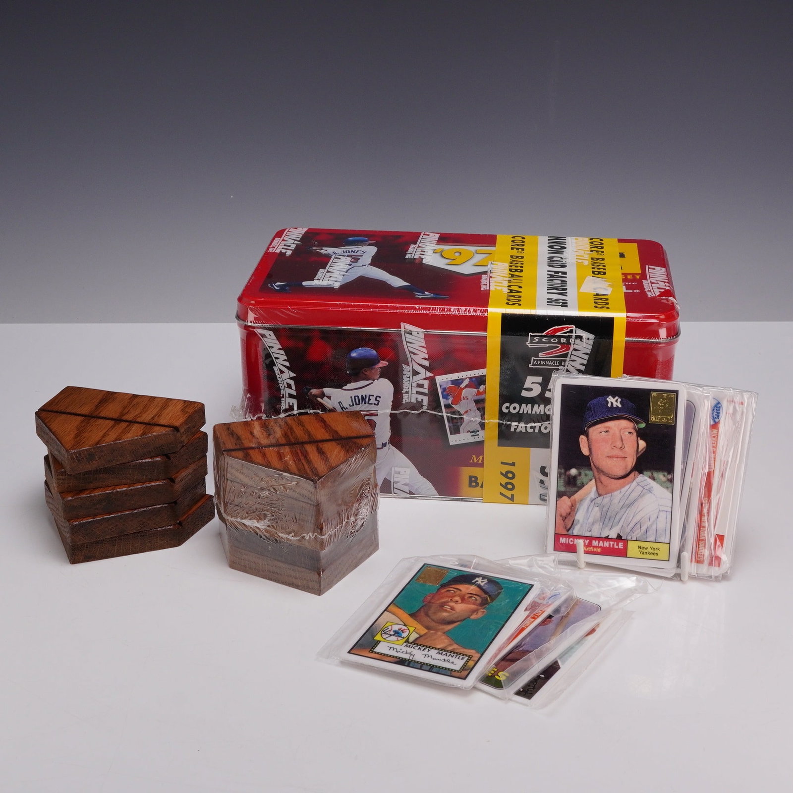 Collection of 1997 Pinnacle Major League Baseball Factory Set Tin, 10 Mickey Mantle Commemorative: This lot features a factory-sealed 1997 Pinnacle Brands, Inc. Major League Baseball 550 common card set. The set is contained within a red commemorative tin depicting professional players Ken Griffey