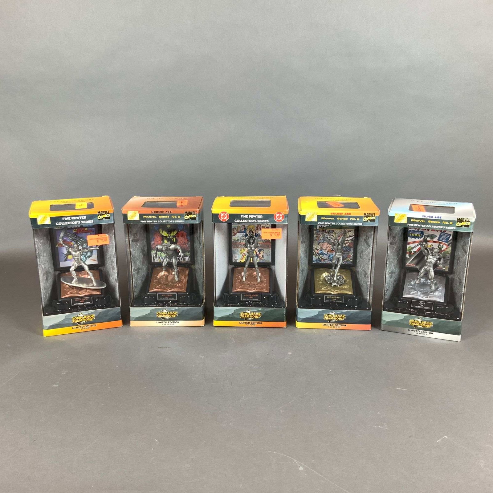 5 Comic Book Champion Figurines, Marvel and DC Comics: This collection consists of 5 limited edition fine pewter comic book character figurines from the Comic Book Champions series produced by Racing Champions, Inc. The group includes depictions of