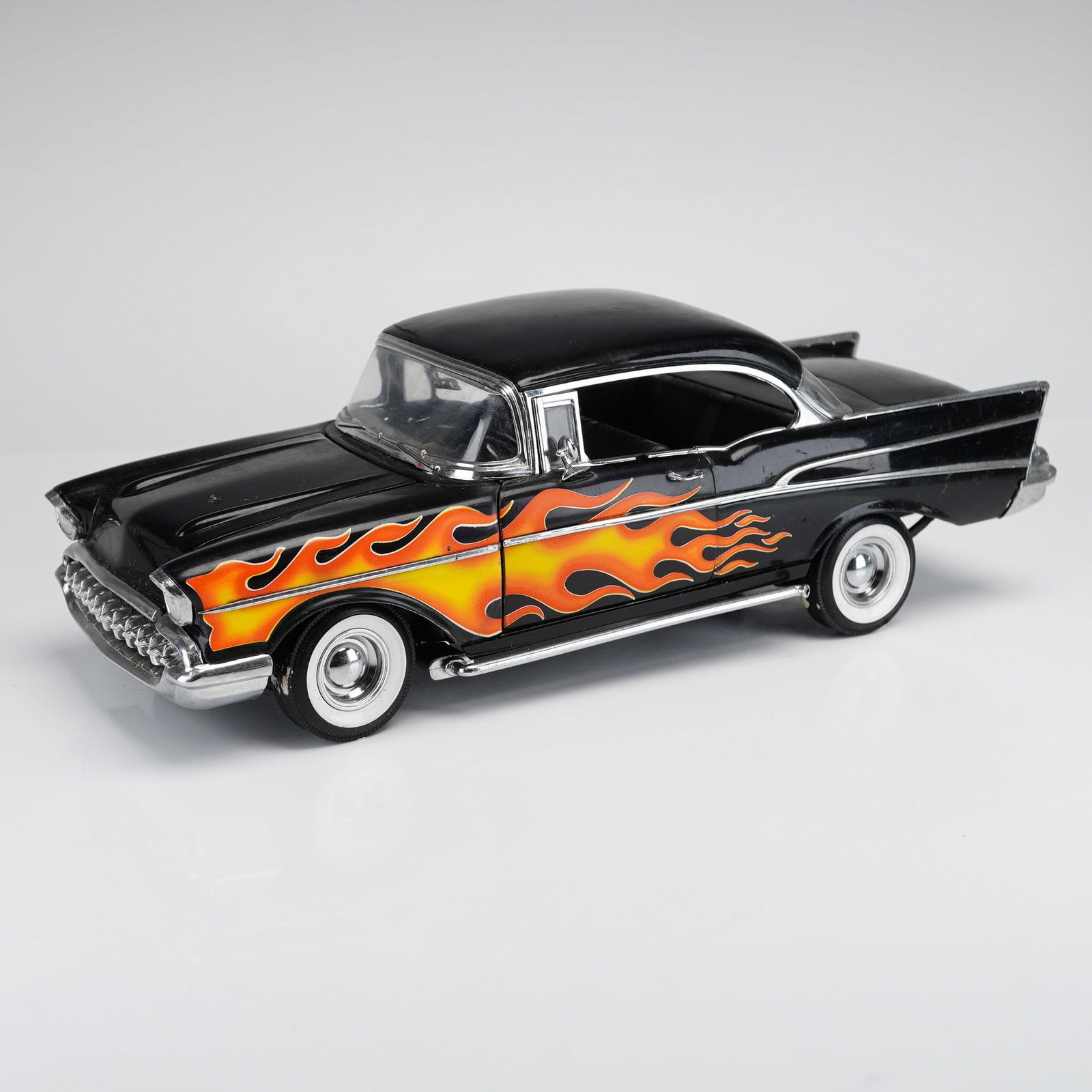 Ertl 1957 Chevrolet Bel Air Custom Hot Rod 1:18 Scale Die-Cast Model Car: Manufactured by Ertl as part of the American Muscle collection, this 1:18 scale 1957 Chevrolet Bel Air Custom Sport Coupe features a die-cast metal body with plastic interior, chassis, and trim compon