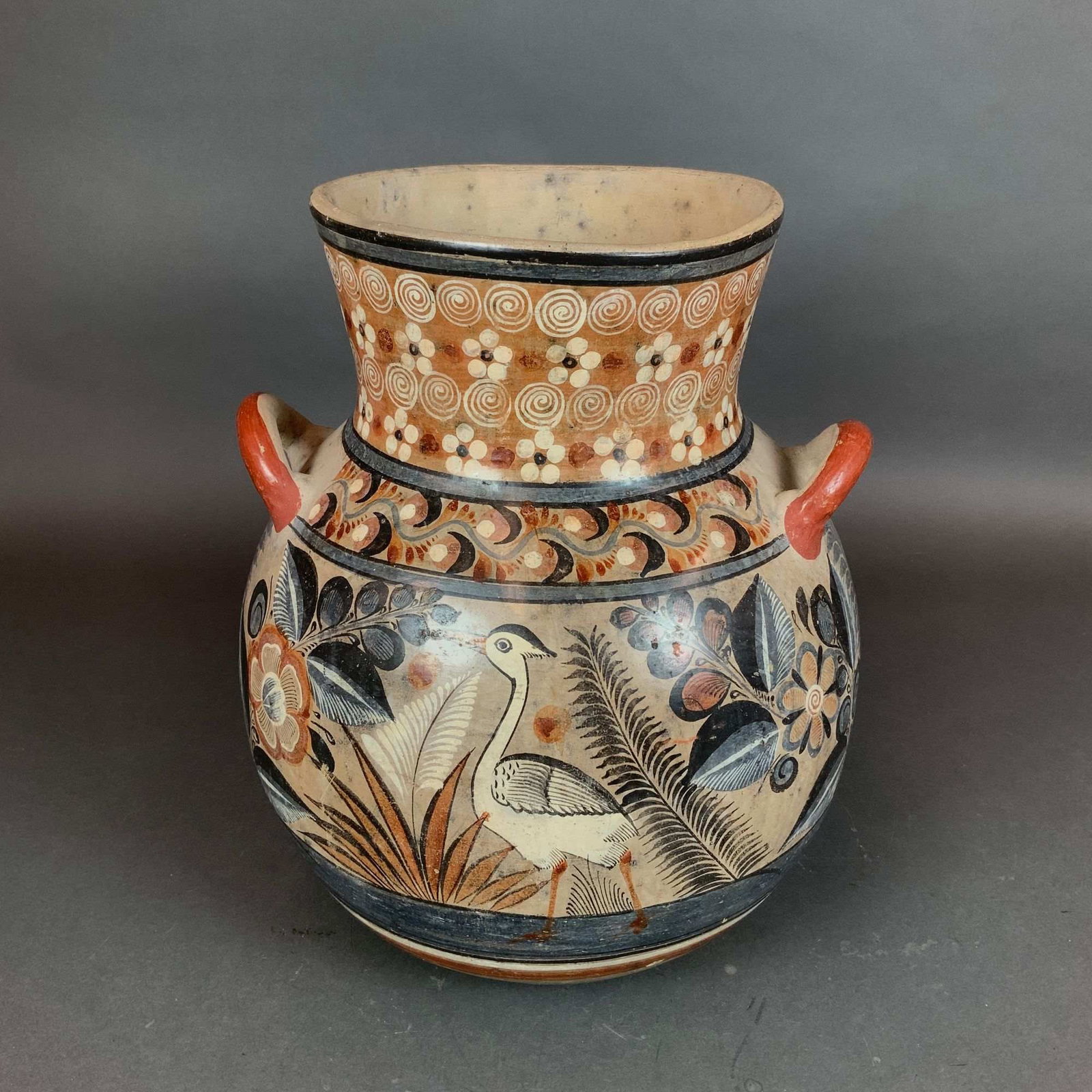 Large Hand Painted Mexican Tonala Style Burnished Pottery Olla Vase with Handles: This is a large-scale, hand-painted burnished earthenware vessel, created in the traditional Tonala style of Jalisco, Mexico. The ceramic is crafted from a light buff-colored clay body, which is visib