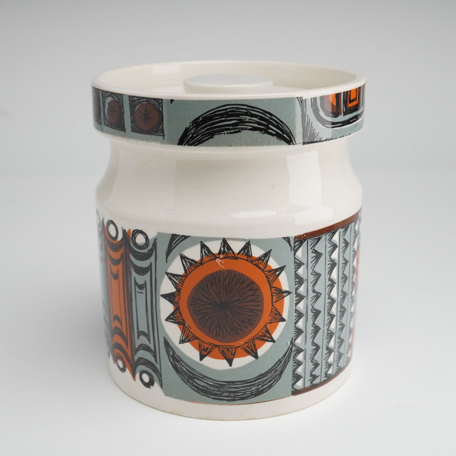 Portmeirion Pottery Magic City Pattern Lidded Jar Designed by Susan Williams-Ellis: A Portmeirion Pottery lidded storage jar in the Magic City pattern designed by Susan Williams-Ellis. This mid-century modern ceramic vessel features a cylindrical body and a matching recessed flat lid