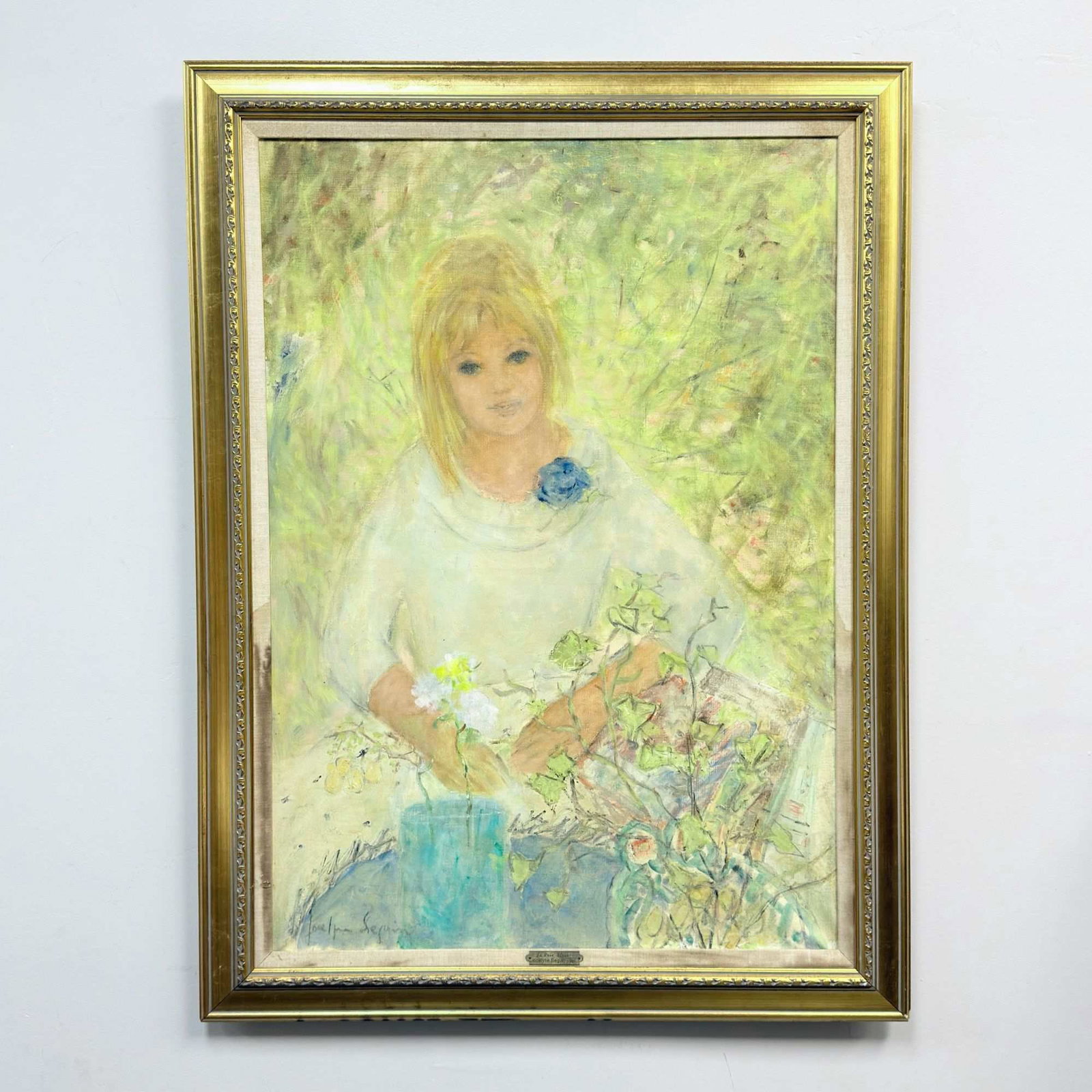 Jocelyne Seguin (French, 1921-1999) La Rose Bleue, Oil on Canvas: This oil on canvas painting, titled La Rose Bleue, is by French artist Jocelyne Seguin (1921-1999). The work features a portrait of a young girl with blonde hair and blue eyes, rendered in a soft Impr