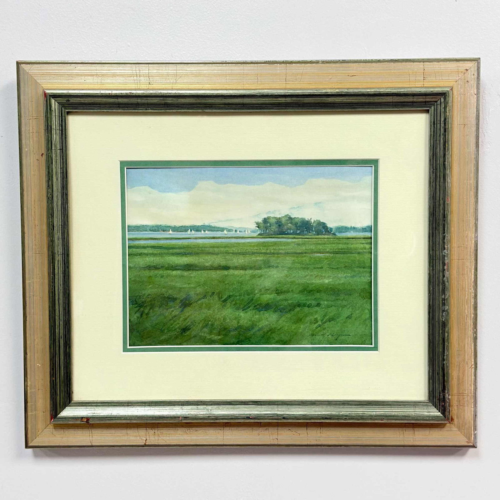 Michael C. Ringer (American, b. 1954), St. Lawrence River Landscape, Original Watercolor, 1999: This original watercolor on paper by Michael C. Ringer depicts a St. Lawrence River landscape. The composition features a wide green marsh in the foreground executed with varied green and blue-green b