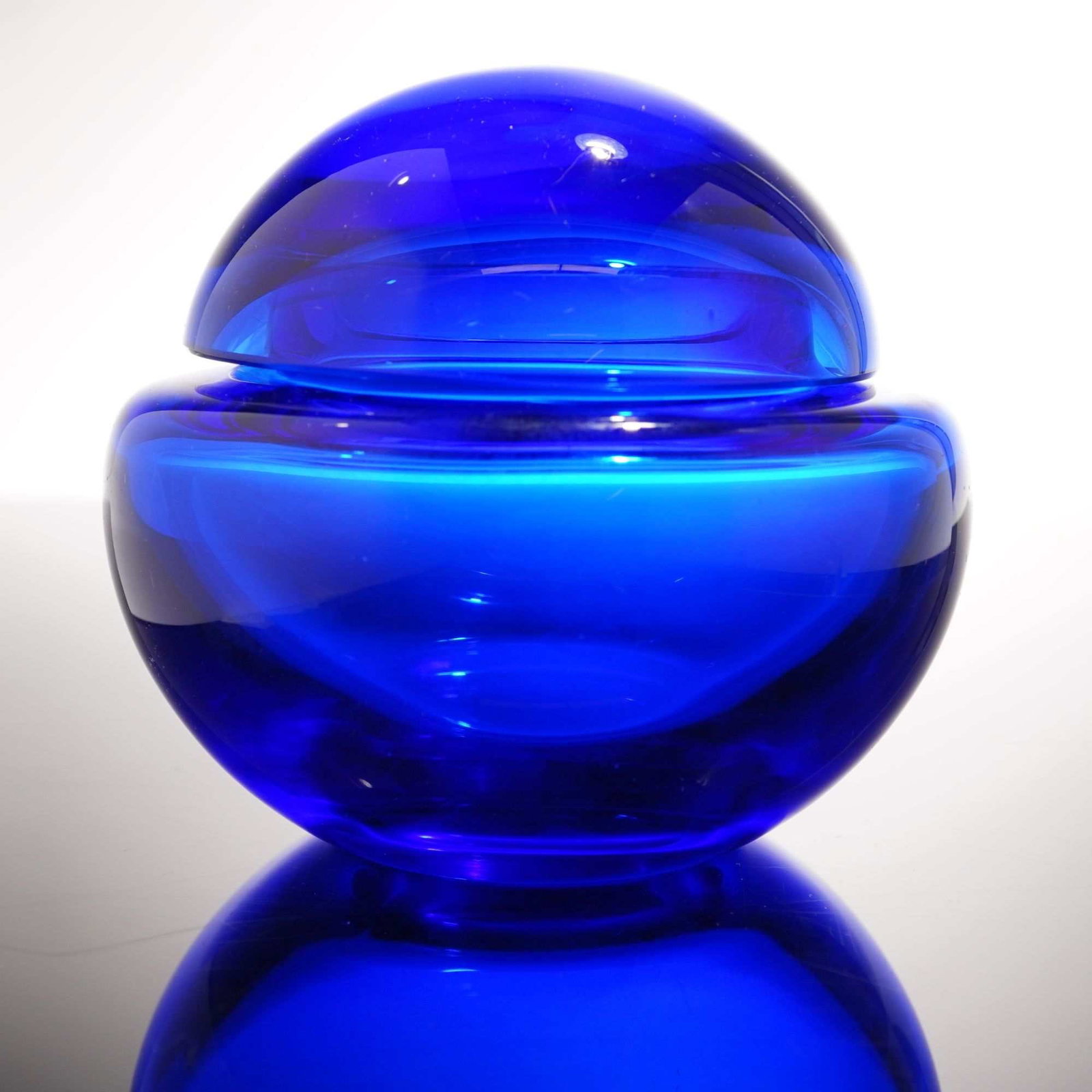 Cobalt Blue Glass Domed Lidded Box: A thick glass lidded box in a cobalt blue color. It features a round body with a domed shaped lid. Dimensions: 4.75"L x 4.75"W x 4.25"H Weight: 1.00 lb 14.00oz