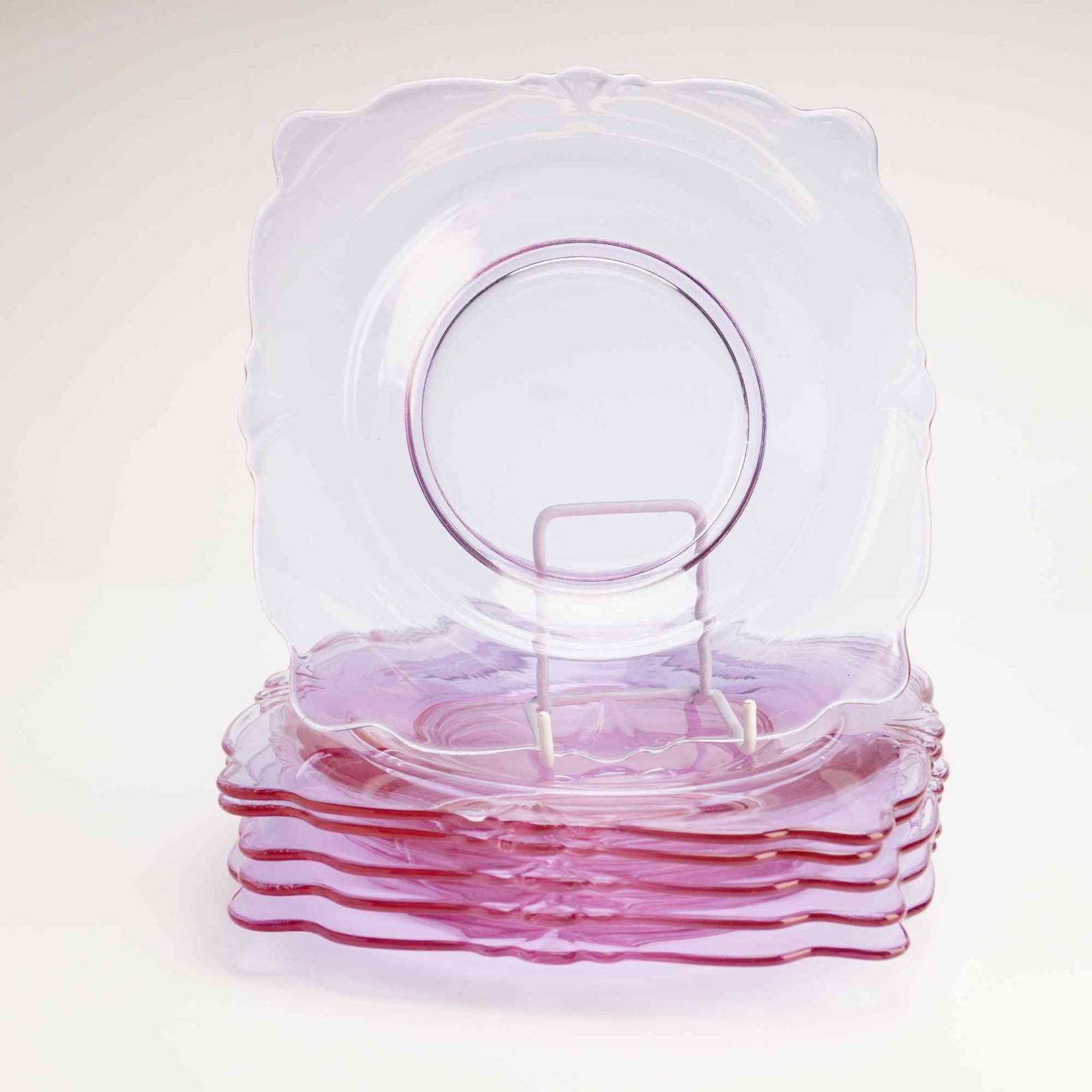 6pc Heisey Empress Pattern Glass Salad Plates: This set of six glass plates was manufactured by A.H. Heisey and Company in the Empress pattern, also known as pattern number 1401. The plates are crafted from Alexandrite glass, a specialized