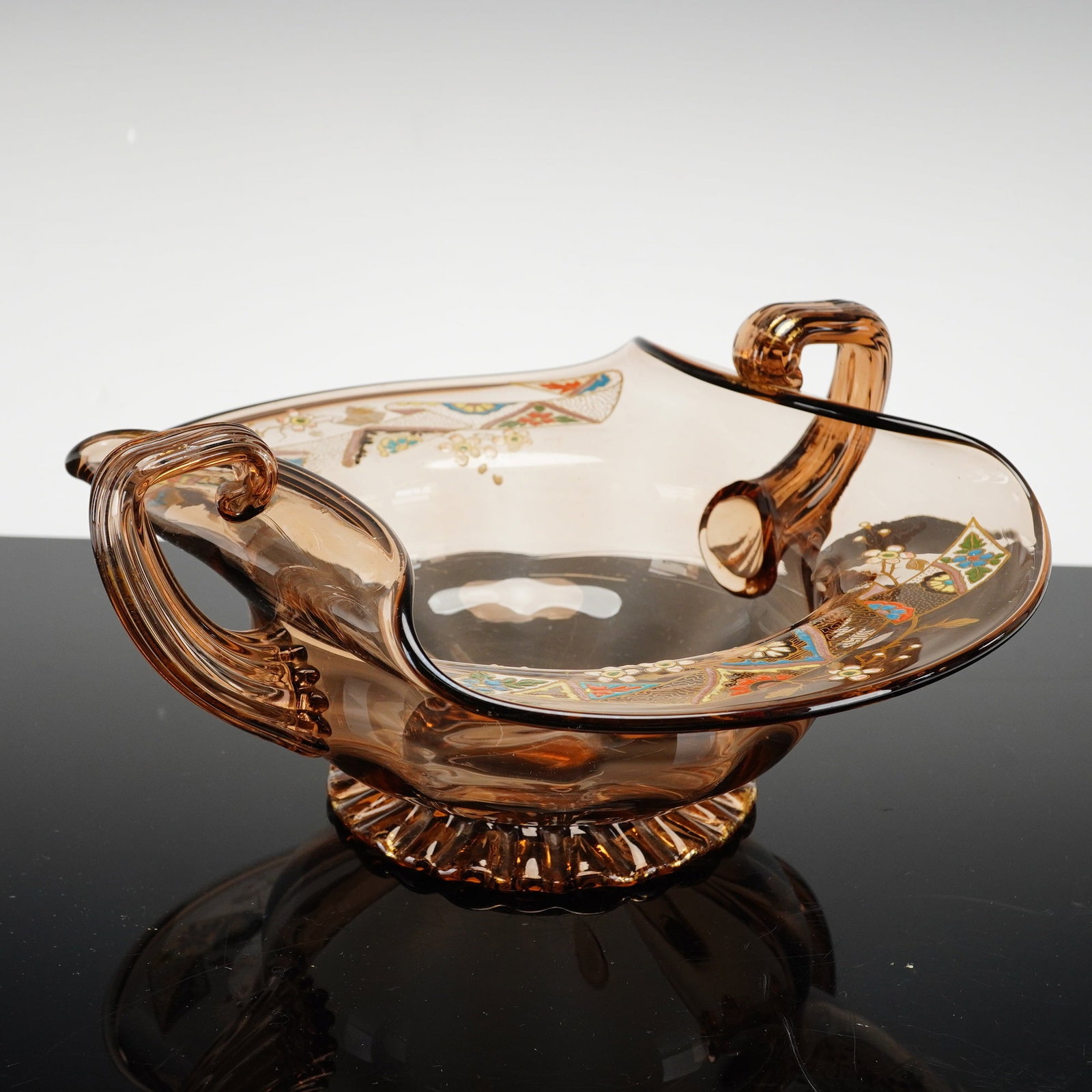 Auguste Jean - b. 1830,Art Glass Circular Footed Bowl with Applied Handles: Auguste Jean, ne en 1830 coupe creuse circulaire, executed in amber-tinted art glass. This elegant circular footed bowl features a flared rim and is adorned with two sculptural, applied loop handles