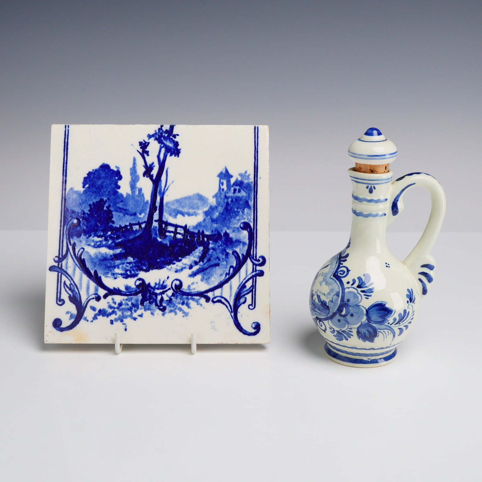 2pc Blue and White Ceramic Items Including a Decorative Landscape Tile and a Delft Oil Cruet (1 of 3)
