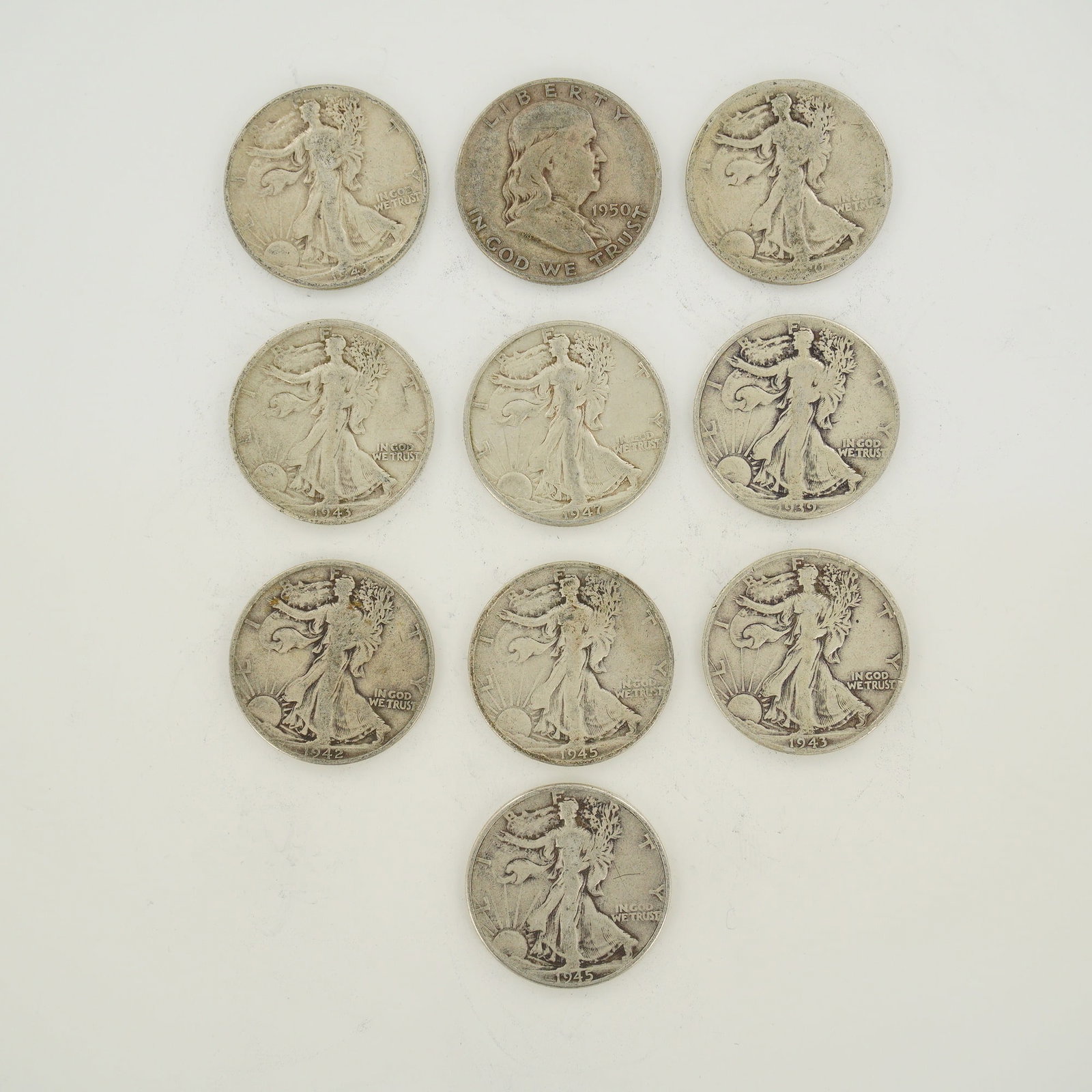 A Collection of 10 US Silver Walking Liberty and Franklin Half Dollars (1 of 2)