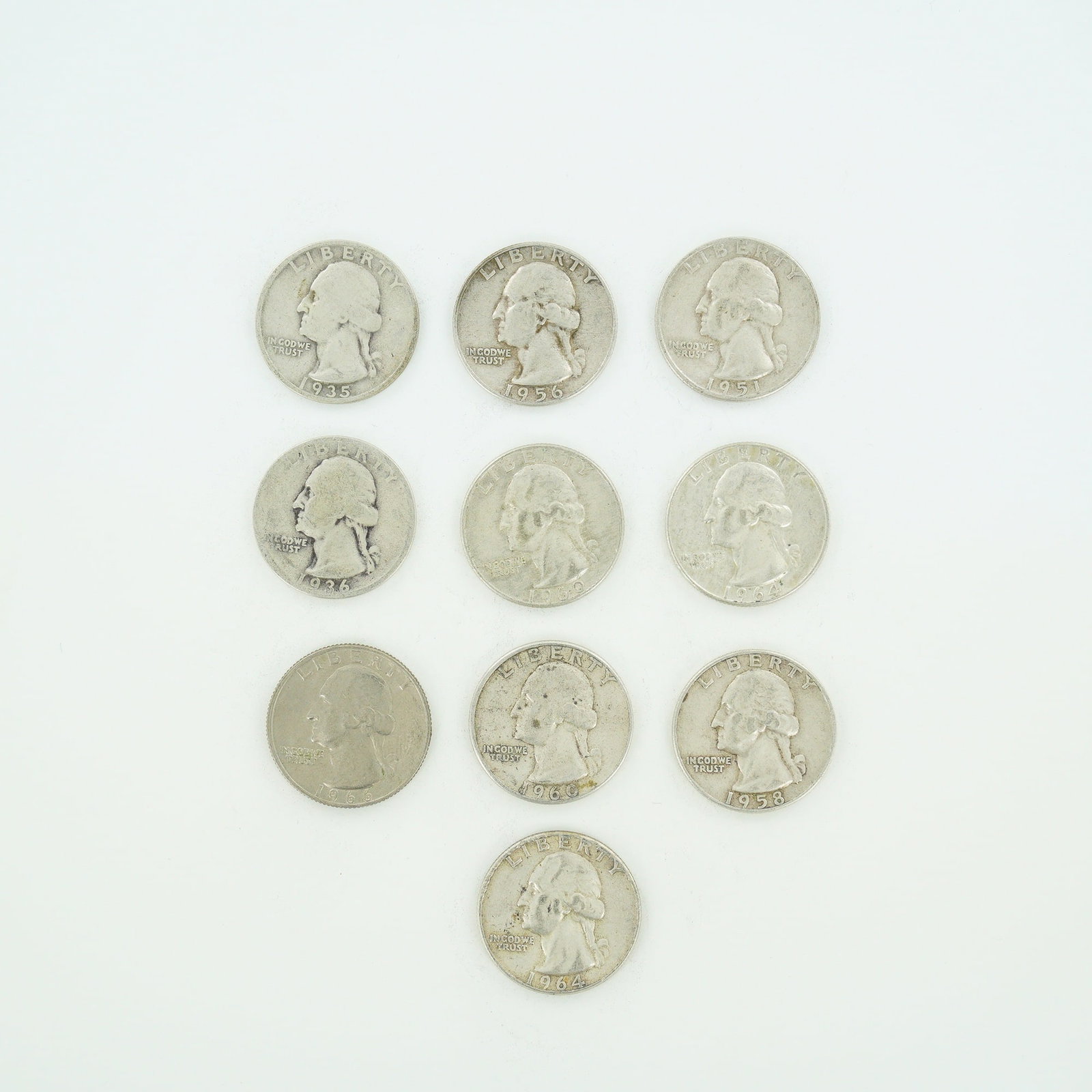 10pc Pre-1964 U.S. 90% Silver Washington Quarters: A collection of ten US Washington quarters, featuring a mixed date bag of nine 90% silver coins and one copper-nickel clad coin. The silver issues include dates 1935, 1936, 1950, 1951-D, 1956-D, 1958,