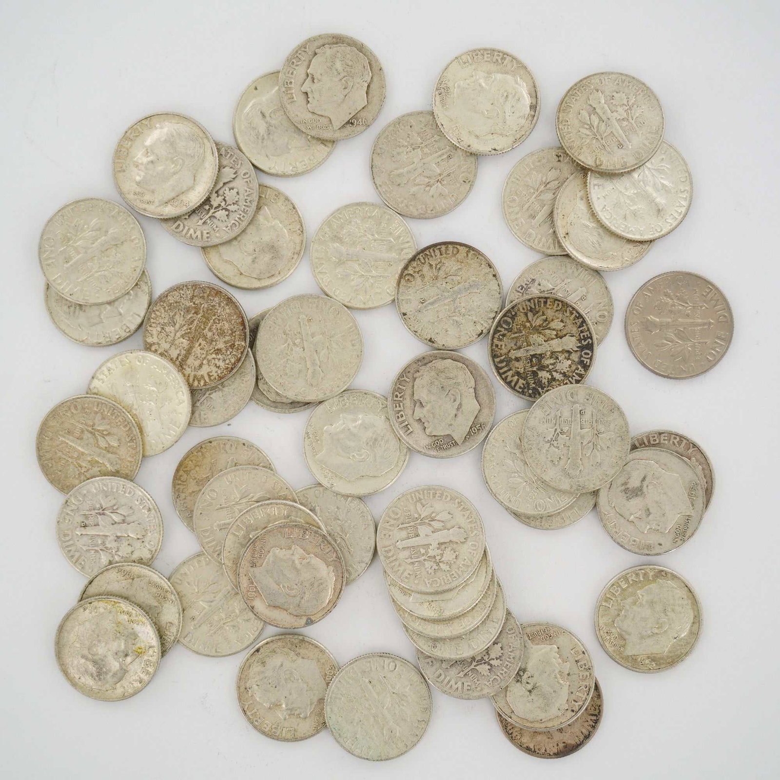 A Collection of US 90% Silver Roosevelt Dimes, Mixed Date Bag: A collection of US Roosevelt dimes, cataloged as a mixed date bag of 90% silver coinage. The assortment includes dates ranging from 1946 to 1964, representing the silver-composition era of the series.