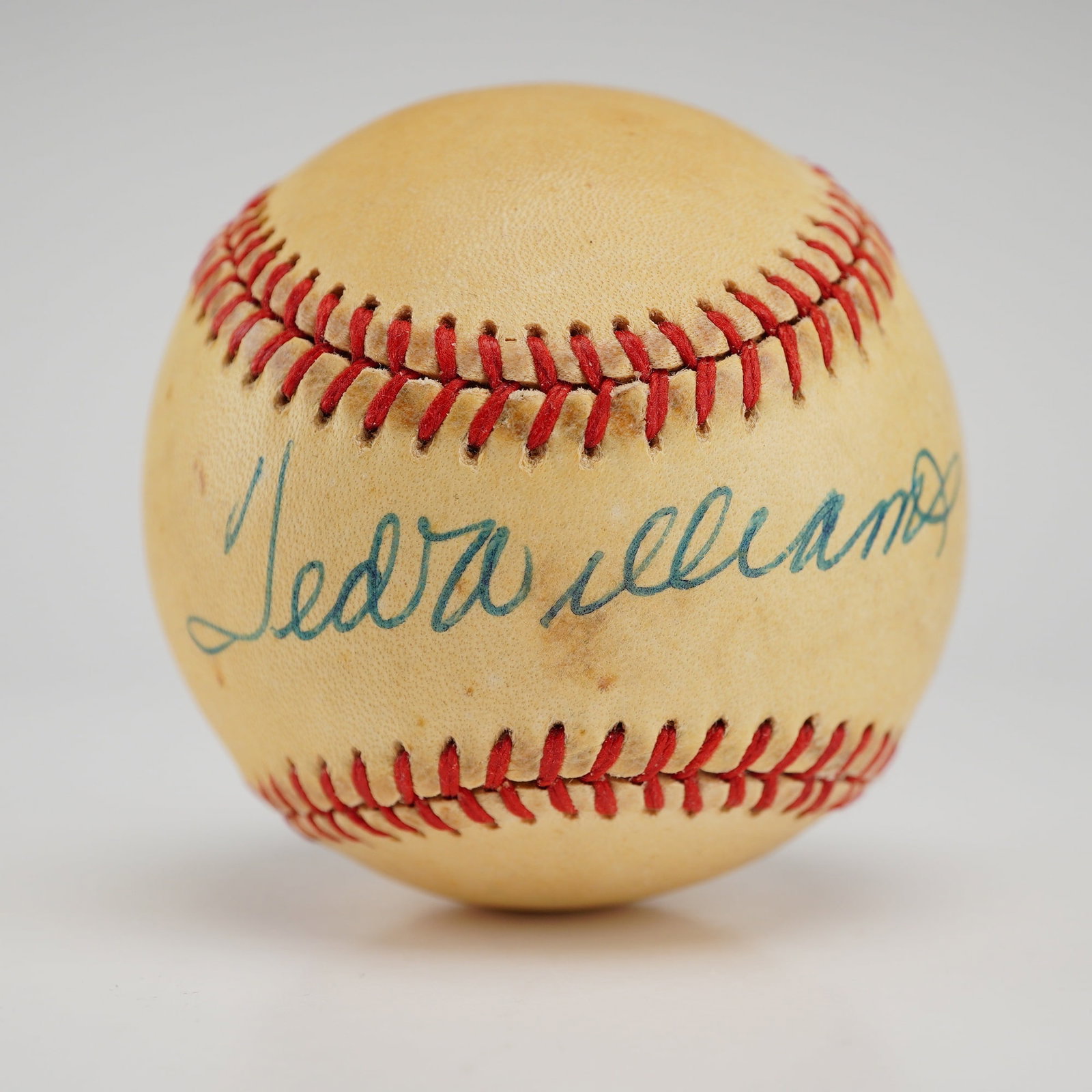 Ted Williams Signed Rawlings Official American League Baseball, PSA/DNA Authenticated: This lot features a Rawlings Official American League Baseball signed by Boston Red Sox legend and Hall of Famer Ted Williams. The signature is prominently placed on the sweet spot in blue-green ink,