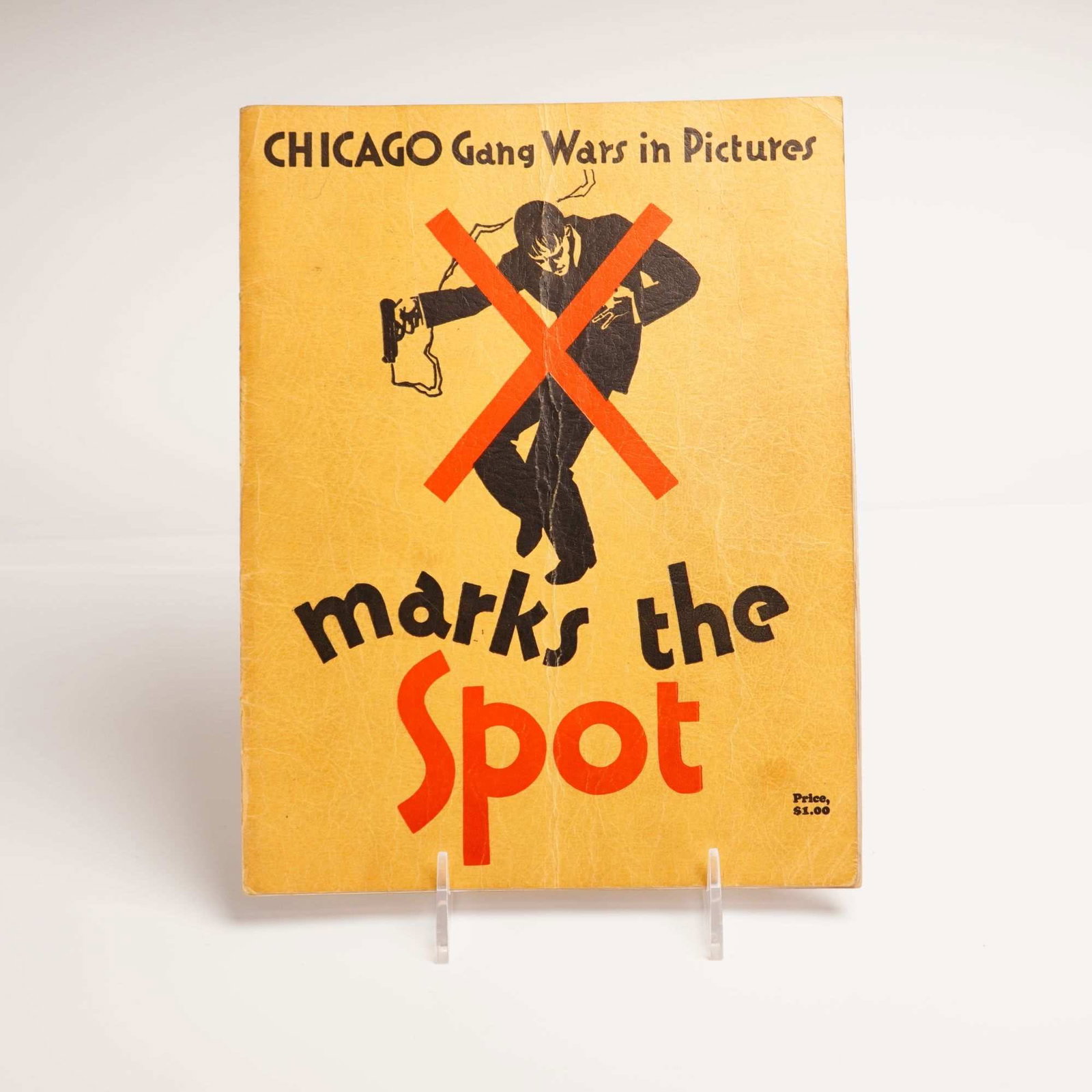 Hansen, Edward. CHICAGO Gang Wars in Pictures: X marks the Spot. The Spot Publishing Company, 1930.: This first edition softcover magazine, titled CHICAGO Gang Wars in Pictures: X marks the Spot, was published in 1930 by The Spot Publishing Company in Chicago. The publication is a quarto-sized,