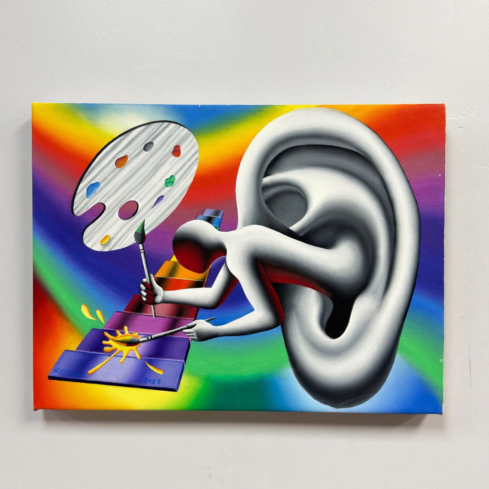 Mark Kostabi (American, b. 1960), Synesthetic Serenade, 2023, Oil on Canvas: This original oil painting on canvas by Mark Kostabi, titled Synesthetic Serenade, is a quintessential example of the artist's Pop-Surrealist style. The composition depicts a large, stylized human
