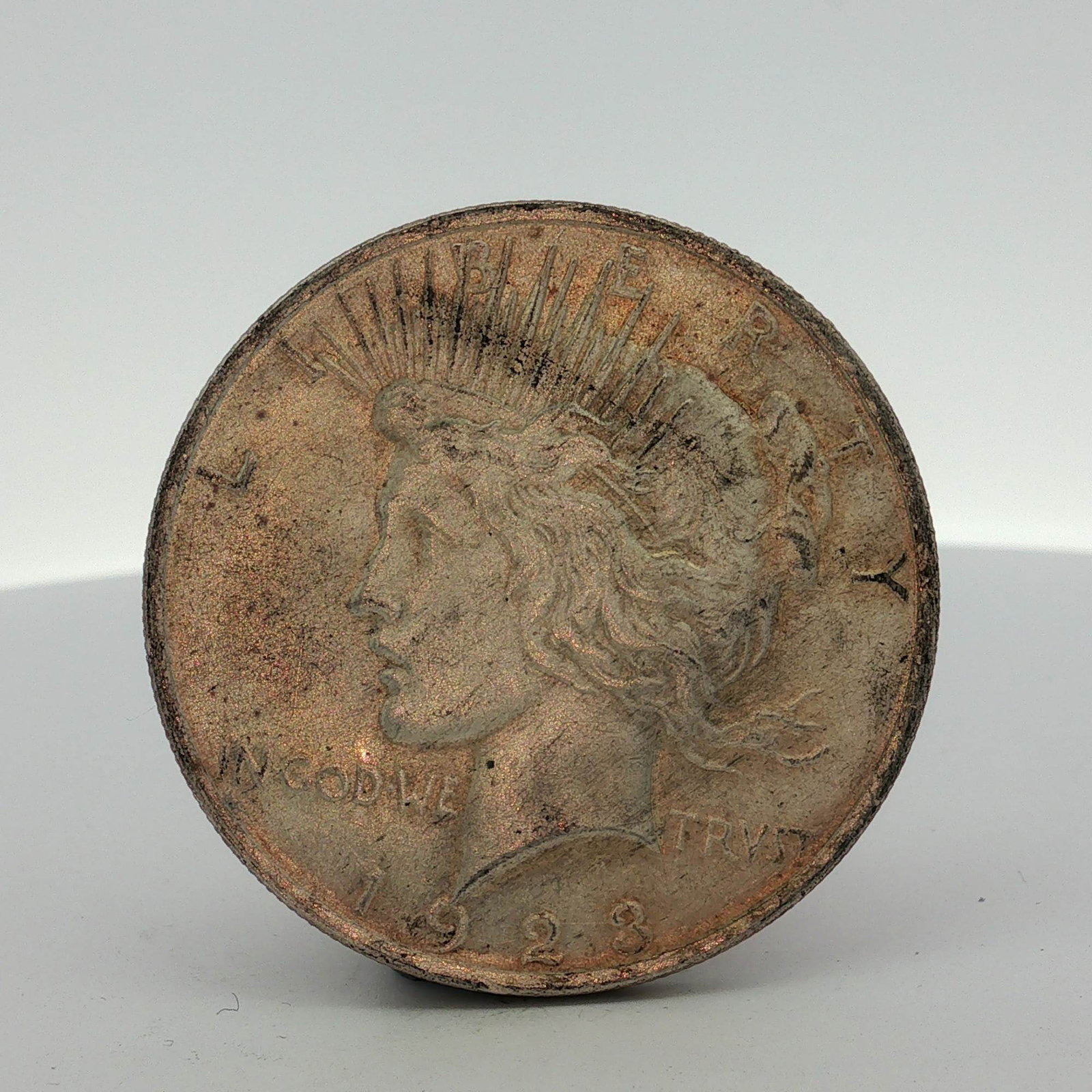 1923 US Silver Peace Dollar: 1923 US Silver Peace Dollar. This coin is struck in 90 percent silver (0.900 fineness) and features the Peace obverse and reverse designs as sculpted by Anthony de Francisci. The specimen was produced