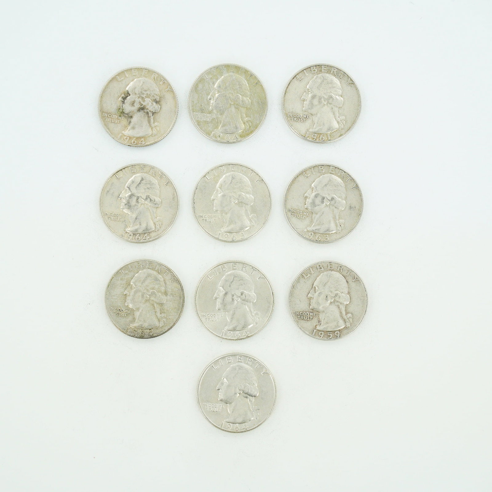 10pc Pre-1964 U.S. 90% Silver Washington Quarters: This collection of ten US Washington quarter dollars consists of a mixed date bag of 90% silver coinage issued prior to the transition to copper-nickel clad composition. The group includes one specime