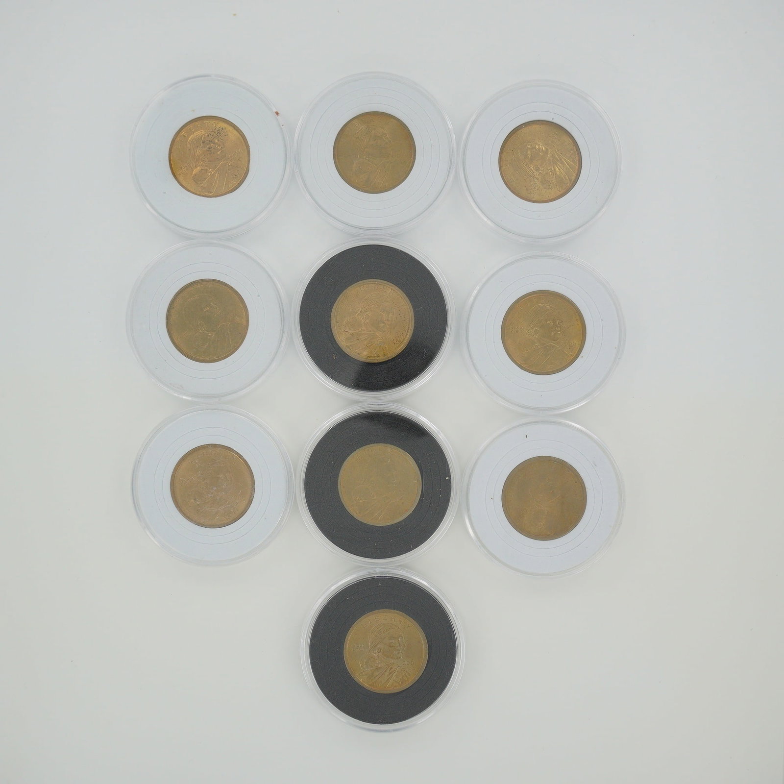 10pc 2000-P Sacagawea Dollars: Designed by Glenna Goodacre and Thomas D. Rogers. A collection of Sacagawea dollar coins minted at the Philadelphia Mint. The obverse depicts Sacagawea carrying her son, Jean Baptiste Charbonneau,