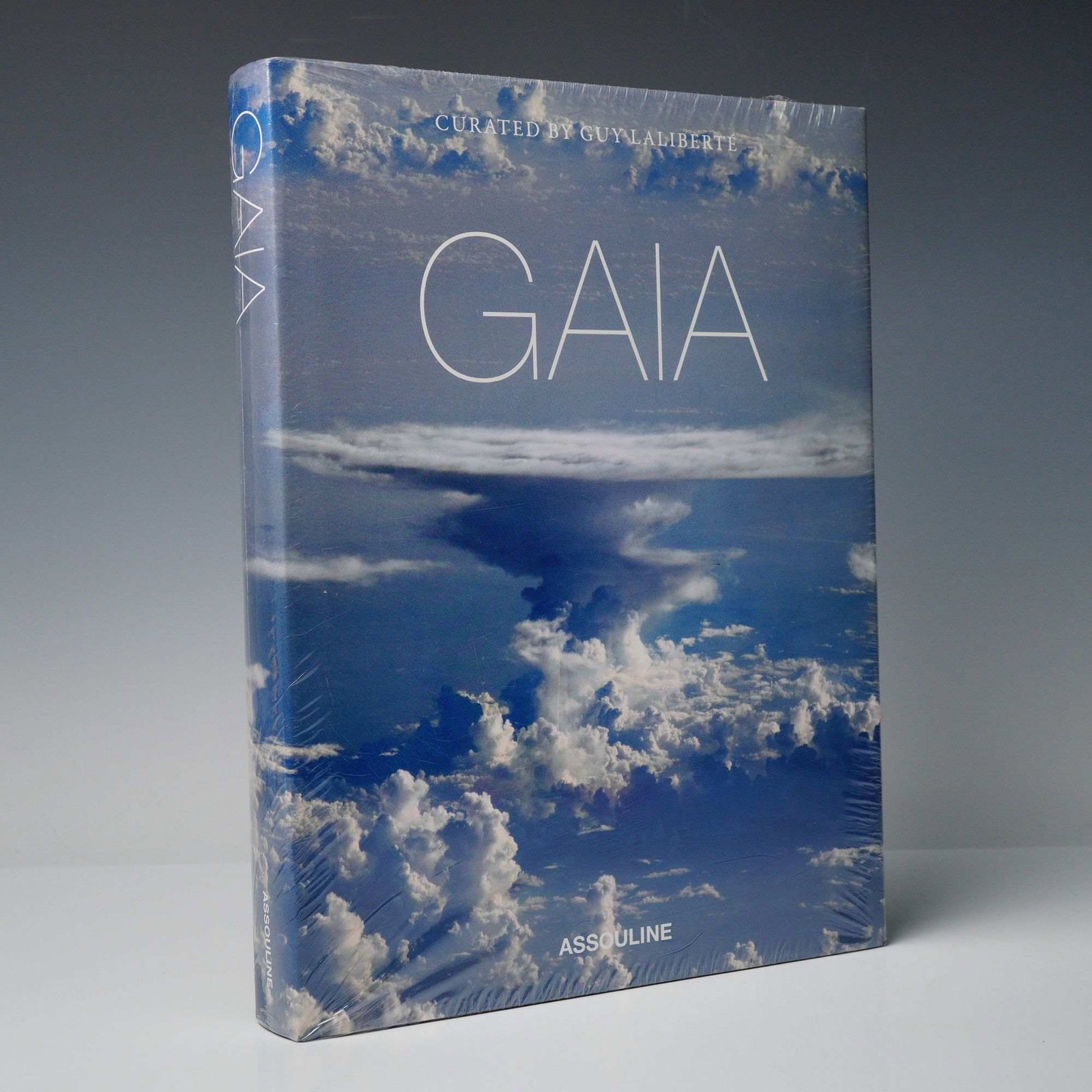 Lalibert?(c), Guy. GAIA: Curated by Guy Laliberte. Assouline, 2011. (DJ): Laliberte, Guy (Curator and Photographer). GAIA: The Earth like you've never seen it before. New York: Assouline, 2011. Apparent First Edition, First Printing. Large format coffee-table book, approxim