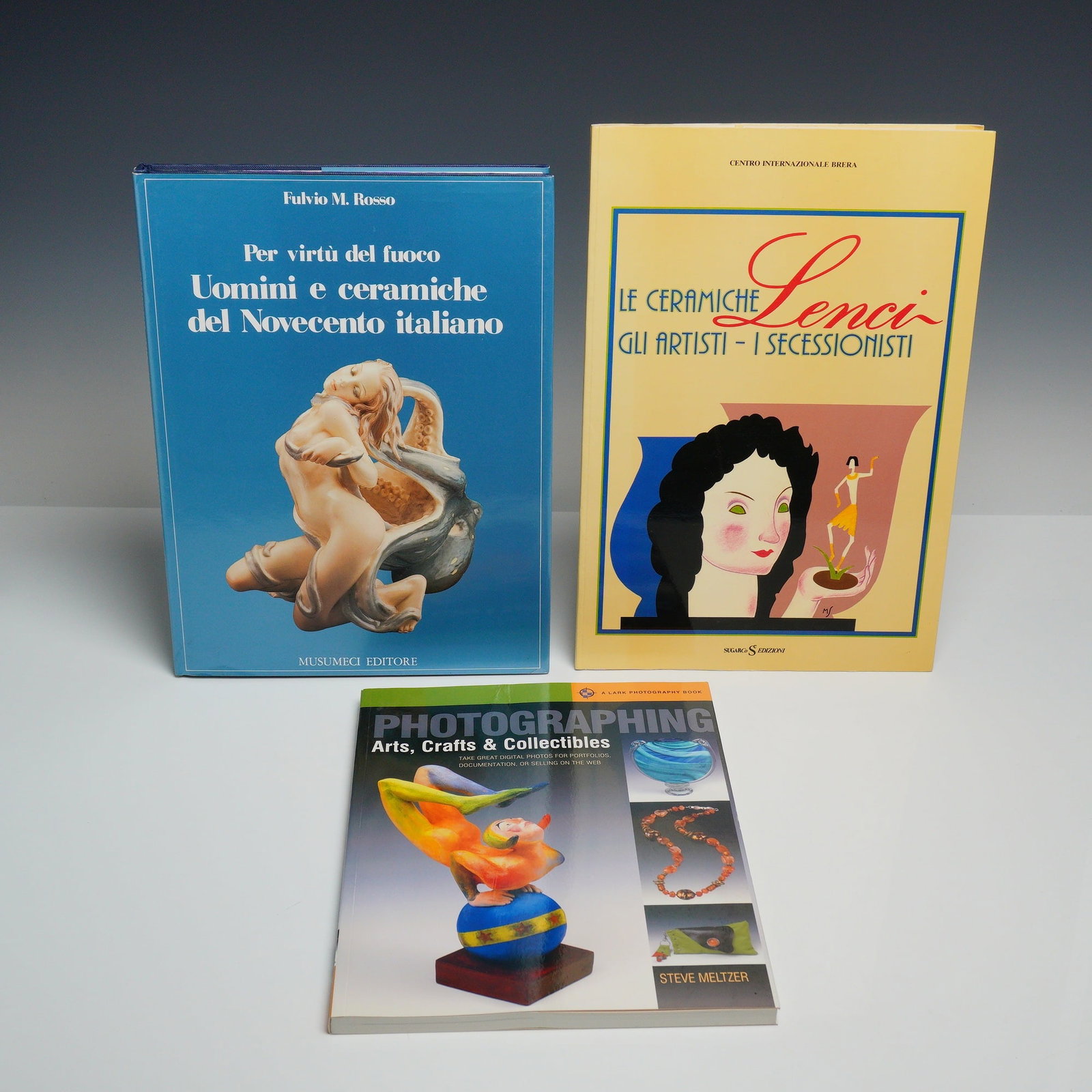 Three Hard and Softcover Books on Italian Ceramics and Photography, Various Publishers, 1983-2007: A trio of books comprising 2pc collectible books on twentieth-century Italian ceramics and one on collectible photography. This collection includes trade paperbacks books and large-format hardcovers f