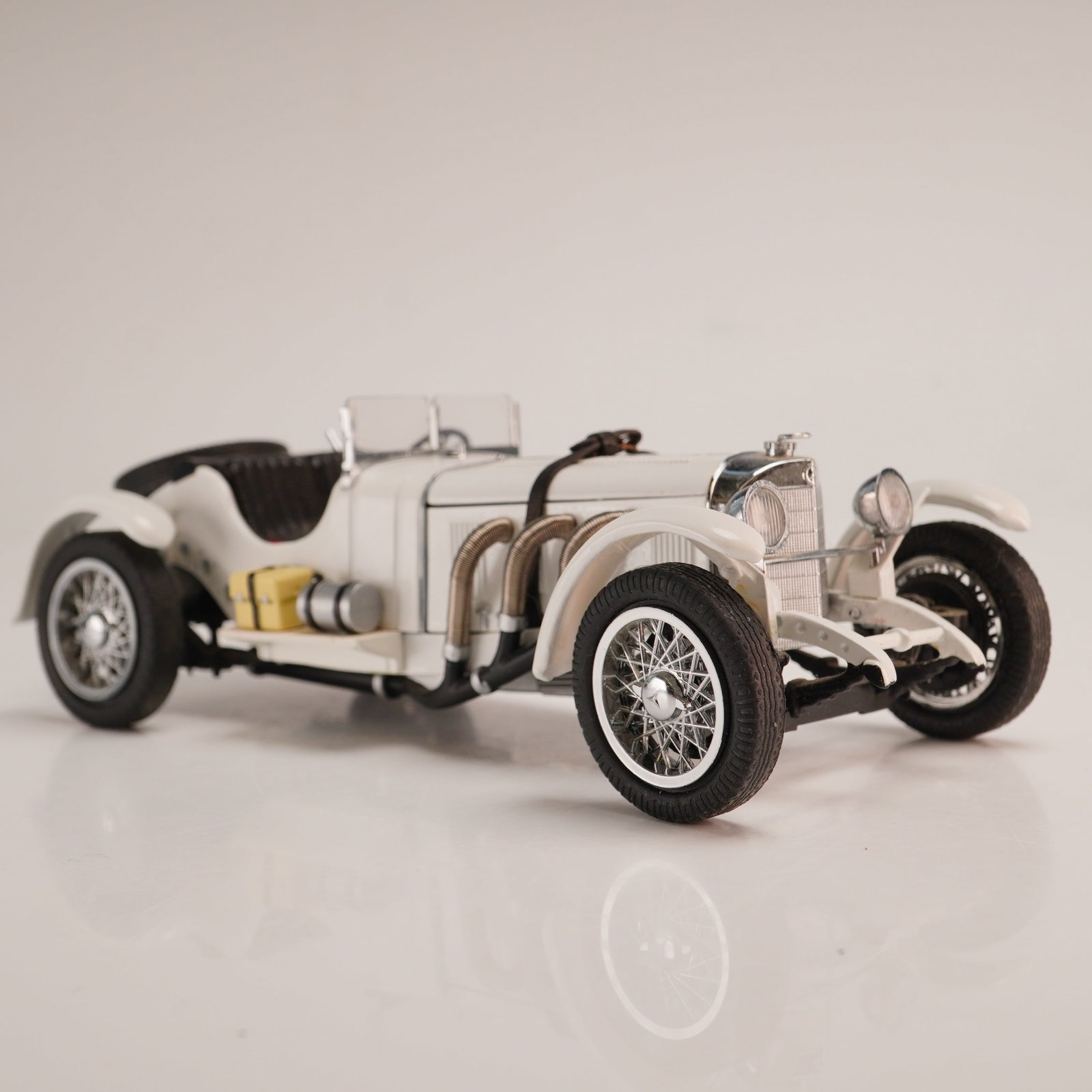 The Danbury Mint Classic Model Car, 1931 Mercedes-Benz SSKL: This 1:24 scale replica of a 1931 Mercedes-Benz SSKL was produced by The Danbury Mint as part of their Classic Cars Collection. The model is constructed from die-cast metal and plastic components