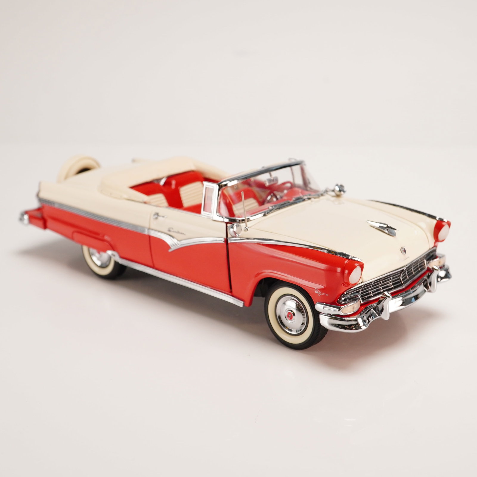 The Danbury Mint Model Car, 1956 Ford Fairlane Sunliner: This is a die-cast 1:24 scale model of a 1956 Ford Fairlane Sunliner convertible produced by Danbury Mint as part of their Classic Cars Collection. The replica is finished in a period-accurate