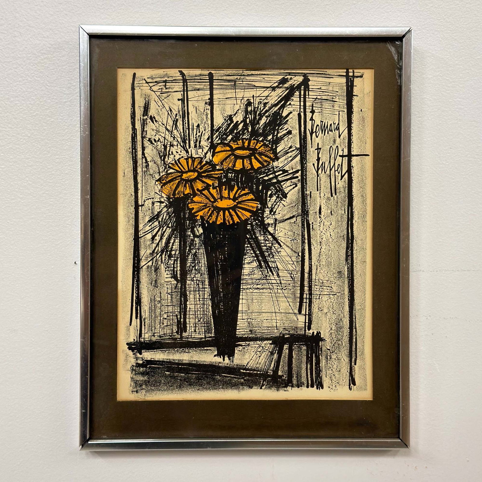Bernard Buffet (French, 1928-1999), Flower, Lithograph: An original lithograph titled Flower by French artist Bernard Buffet (1928-1999). The composition depicts a still life of three yellow-petaled flowers in a tapered black vase, rendered in Buffet's