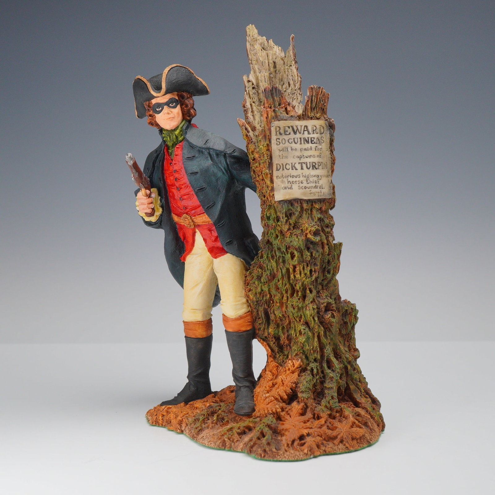 Royal Doulton Figurine, Dick Turpin HN3637: This Royal Doulton hand-painted sculpture (HN3637) depicts the 18th-century highwayman Dick Turpin in a tricorn hat, domino mask, and dark blue overcoat. He is posed with a flintlock pistol beside a