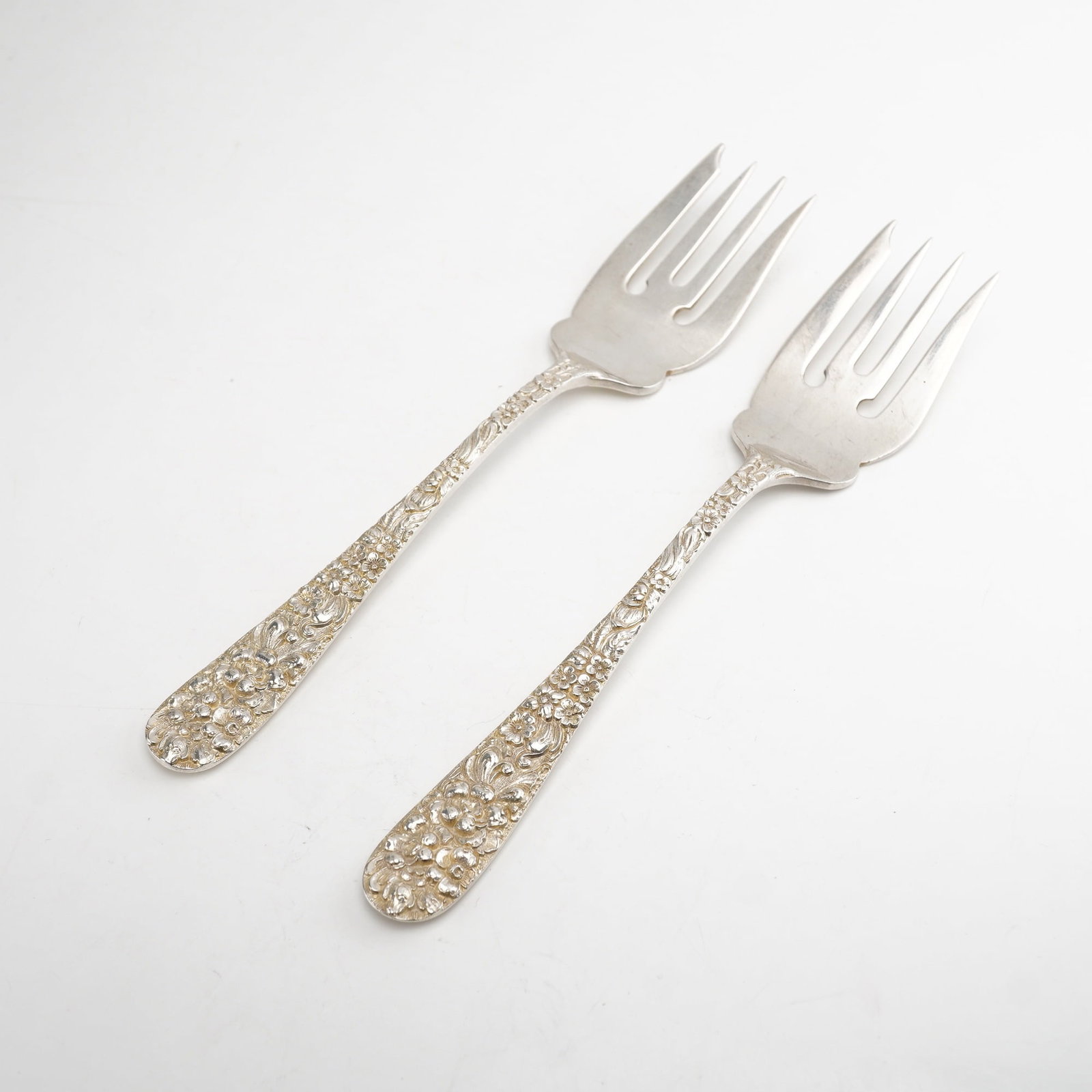 2pc Kirk Stieff Sterling Silver Salad Forks, Stieff Rose: Set of two salad forks in the classic "Stieff Rose" pattern by Kirk Stieff, first introduced in 1892. Each fork features an intricately detailed sterling silver handle adorned with ornate floral repou
