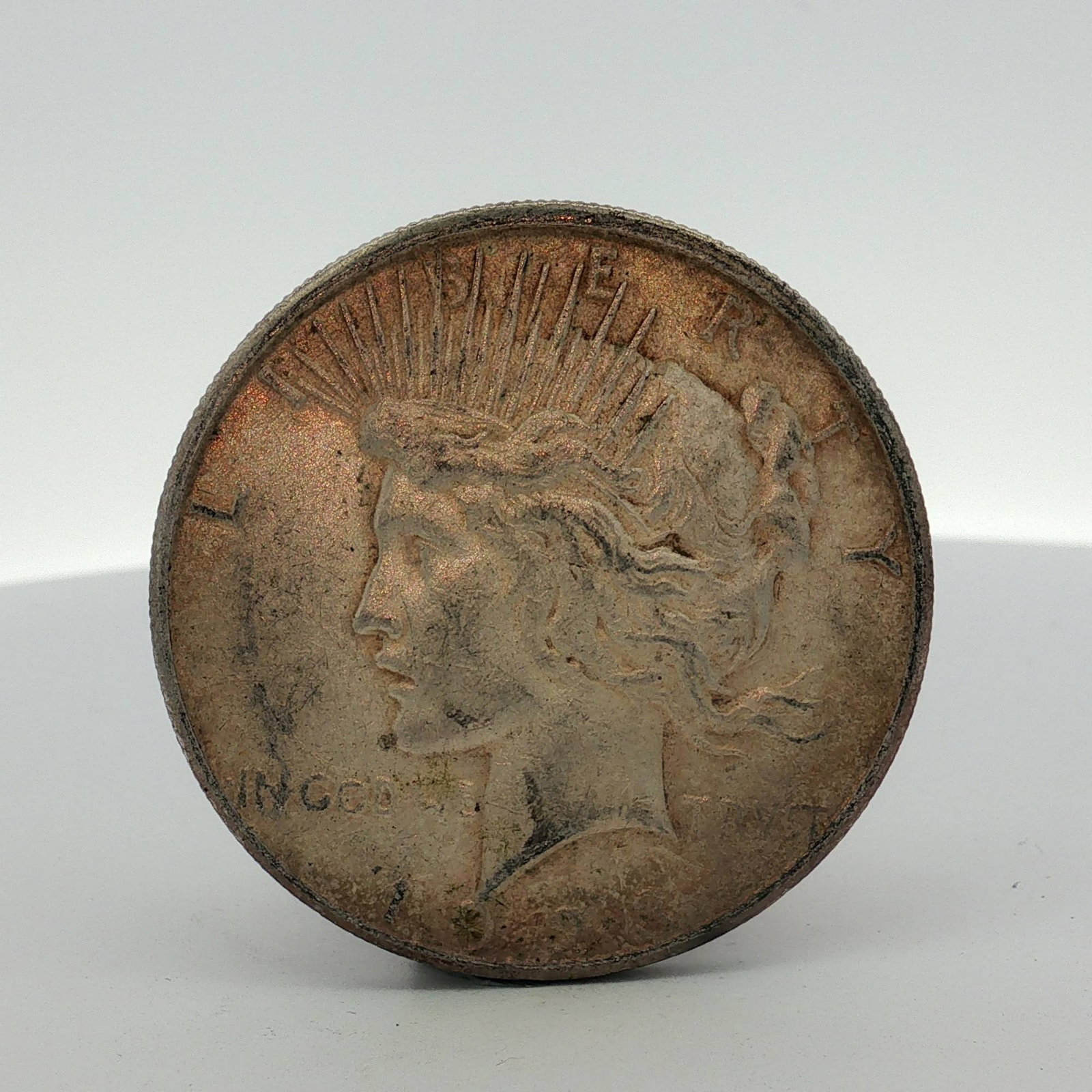 1923-S US Peace Silver Dollar: This 1923-S US Peace silver dollar was struck at the San Francisco mint. The coin is composed of 90% silver and 10% copper. The obverse features the Peace dollar design with inscriptions LIBERTY, IN