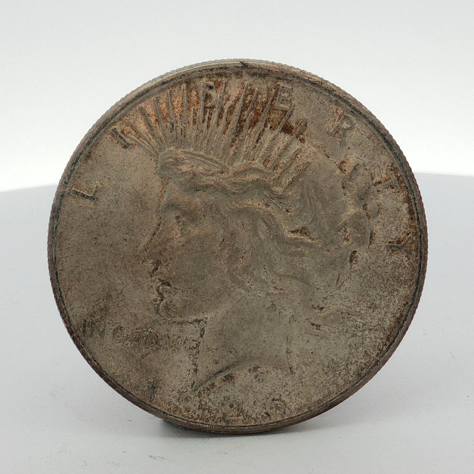 1926-S US Peace Silver Dollar: One US Peace silver dollar coin dated 1926. This specimen features an S mint mark on the reverse, signifying production at the San Francisco Mint. The coin is composed of 90 percent silver and 10