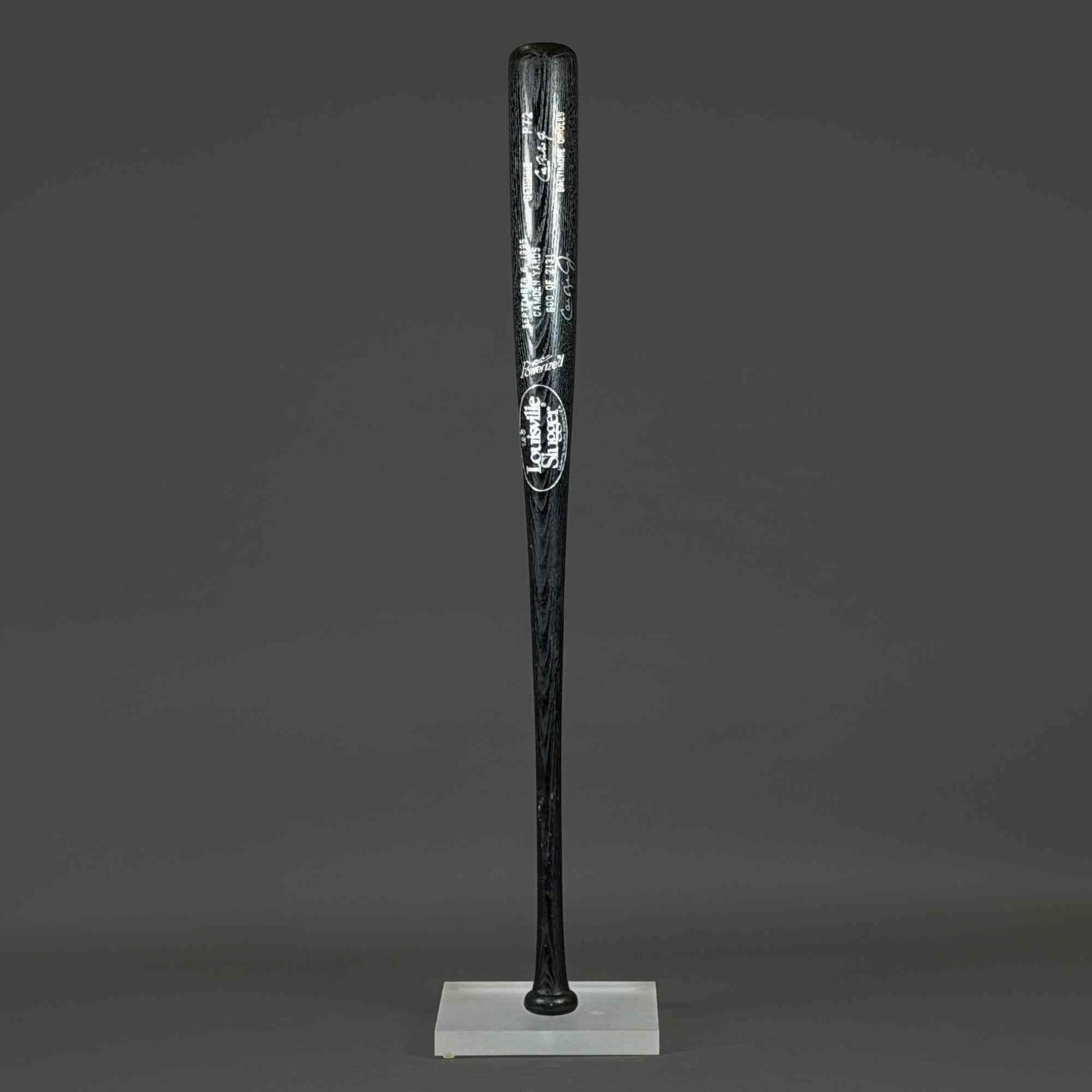 Cal Ripken Jr. Signed Louisville Slugger 125 Camden Yards Limited Edition 600 of 2131 Baseball Bat: A limited edition Louisville Slugger 125 commemorative baseball bat honoring Cal Ripken Jr. and his record-breaking 2,131st consecutive game played for the Baltimore Orioles. The bat features a black 