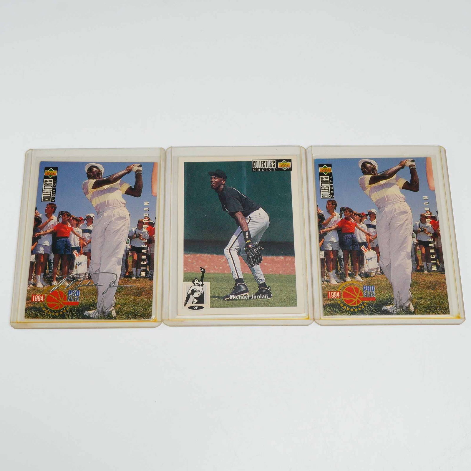 3pc 1994 Upper Deck Collector's Choice Michael Jordan Trading Cards including Silver Signature: This lot features three sports trading cards from the 1994 Upper Deck Collector's Choice series, all depicting Michael Jordan. The set includes card number 23, which shows Jordan in a baseball fieldin