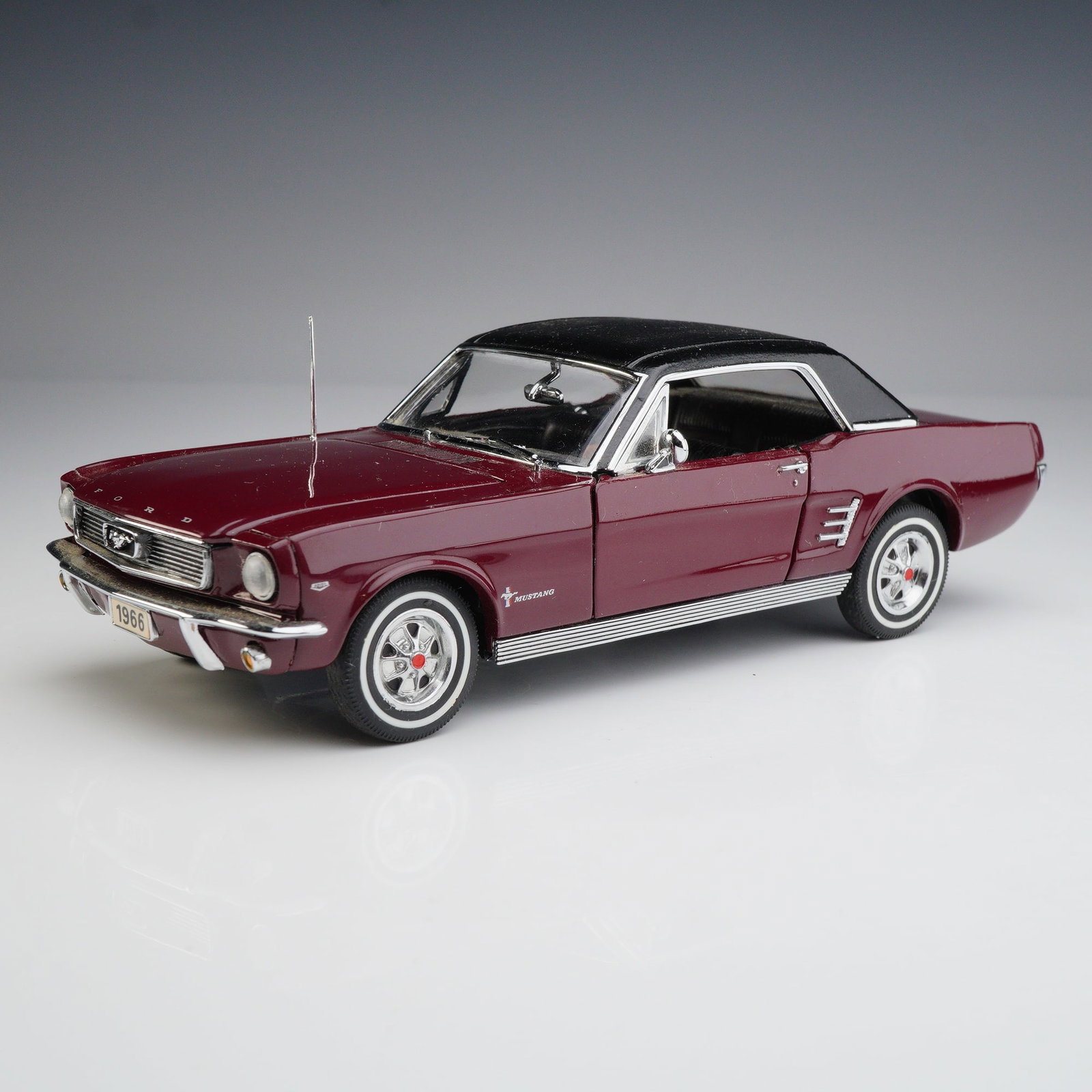 Danbury Mint 1:24 Scale 1966 Ford Mustang Hardtop Classic Cars Collection with COA: This precision die-cast model is a 1:24 scale replica of a 1966 Ford Mustang Hardtop, part of the Danbury Mint Classic Cars Collection. The model is constructed from die-cast metal with plastic