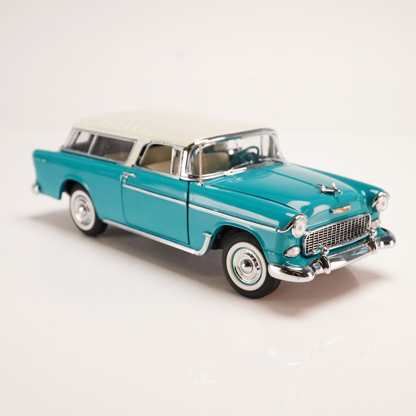 The Danbury Mint Classic Model Car, 1955 Chevrolet Nomad: This is a precision 1:24 scale die-cast model of a 1955 Chevrolet Nomad from The Danbury Mint Classic Cars Collection. The model is finished in a period-accurate two-tone Regal Turquoise and India