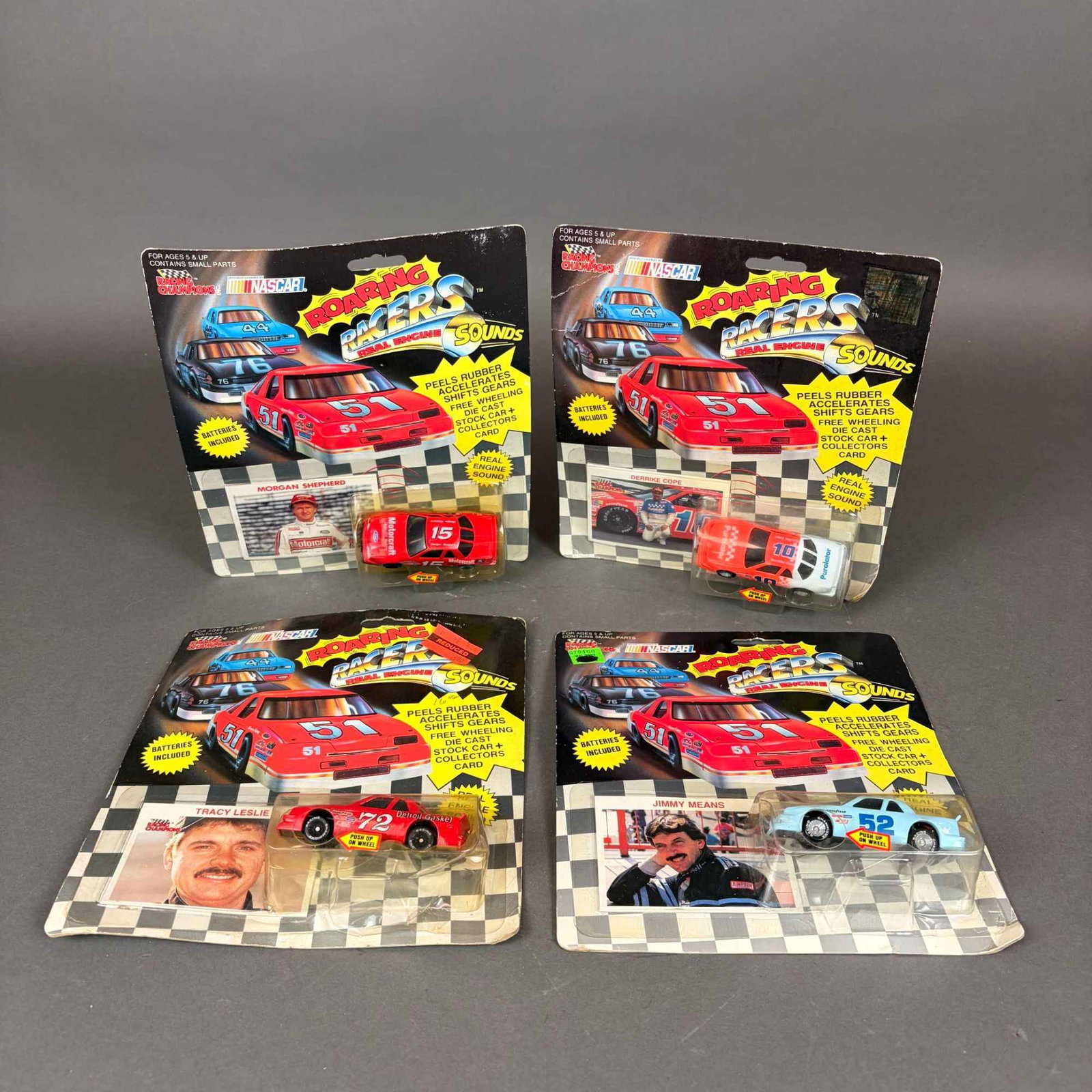 4pc Racing Champions NASCAR Die Cast Stock Cars with Collectors Card: Collection includes four Racing Champions NASCAR die-cast stock cars in original packaging, each accompanied by a collector card. Featured drivers include Derrike Cope #10, Morgan Shepherd #15, Jimmy