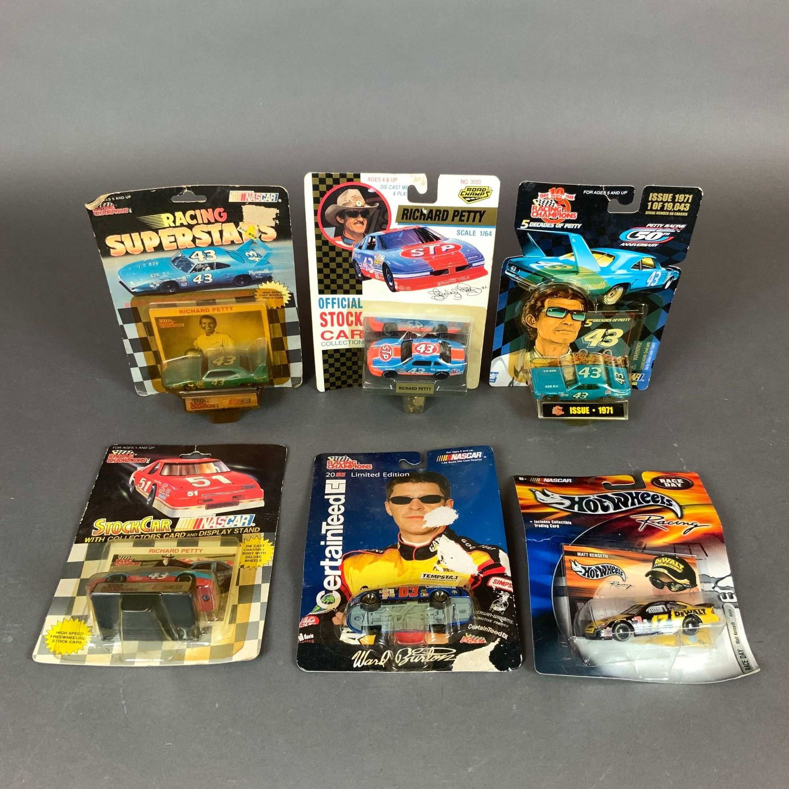 6pc Nascar Car Models: Richard Petty, Ward Burton & Matt Kenseth: A collection of 6pc NASCAR collectible car models in 1:64 scale, primarily featuring Hall of Fame driver Richard Petty. The lot includes various manufacturers and series from the 1990s and early