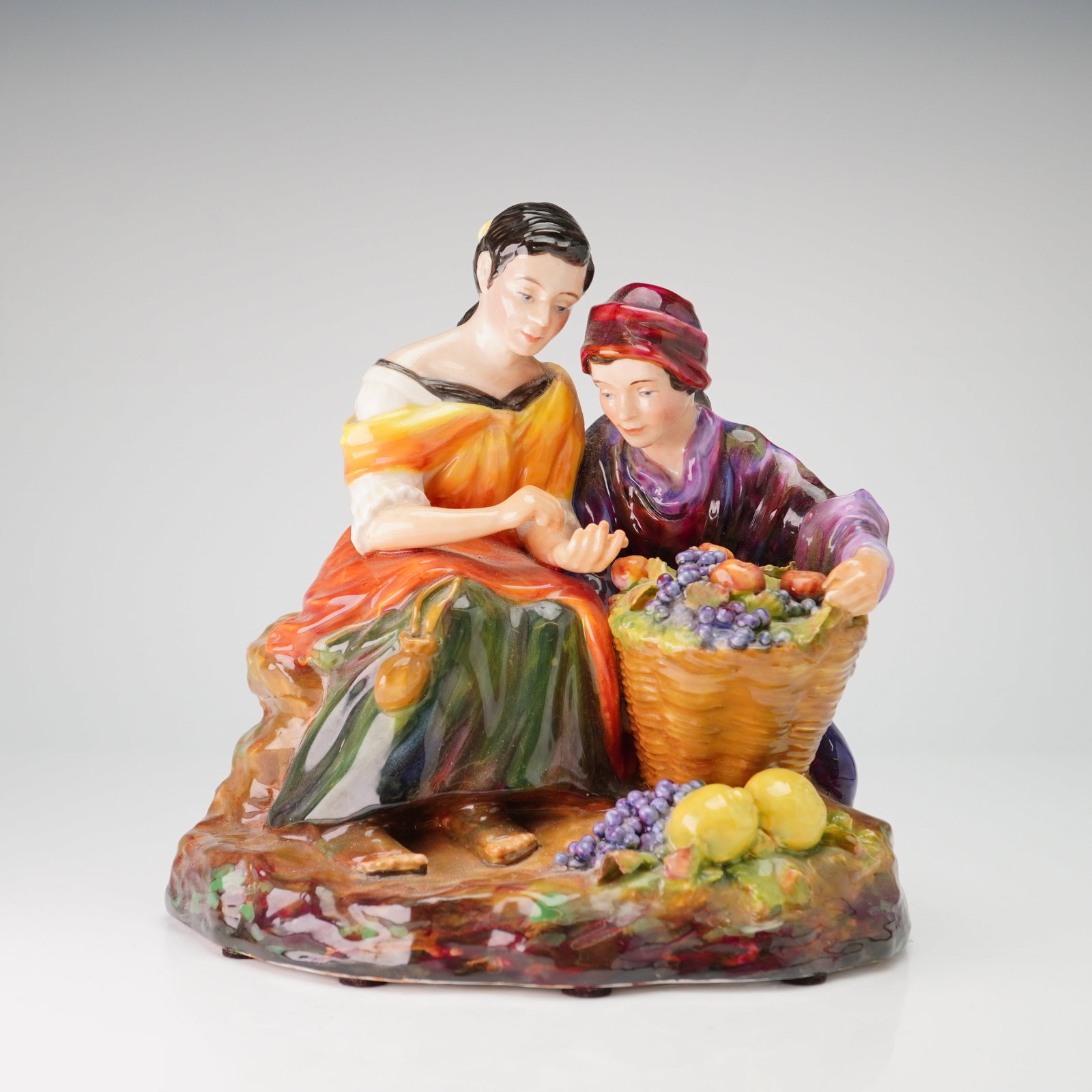 Studio Pottery by Reg Johnson Figurine, Fruit Sellers: A hand-painted glazed porcelain studio pottery figure group titled Fruit Sellers, based on the circa 1670 painting by Spanish Baroque artist Bartolome Esteban Murillo, created by studio potter Reg