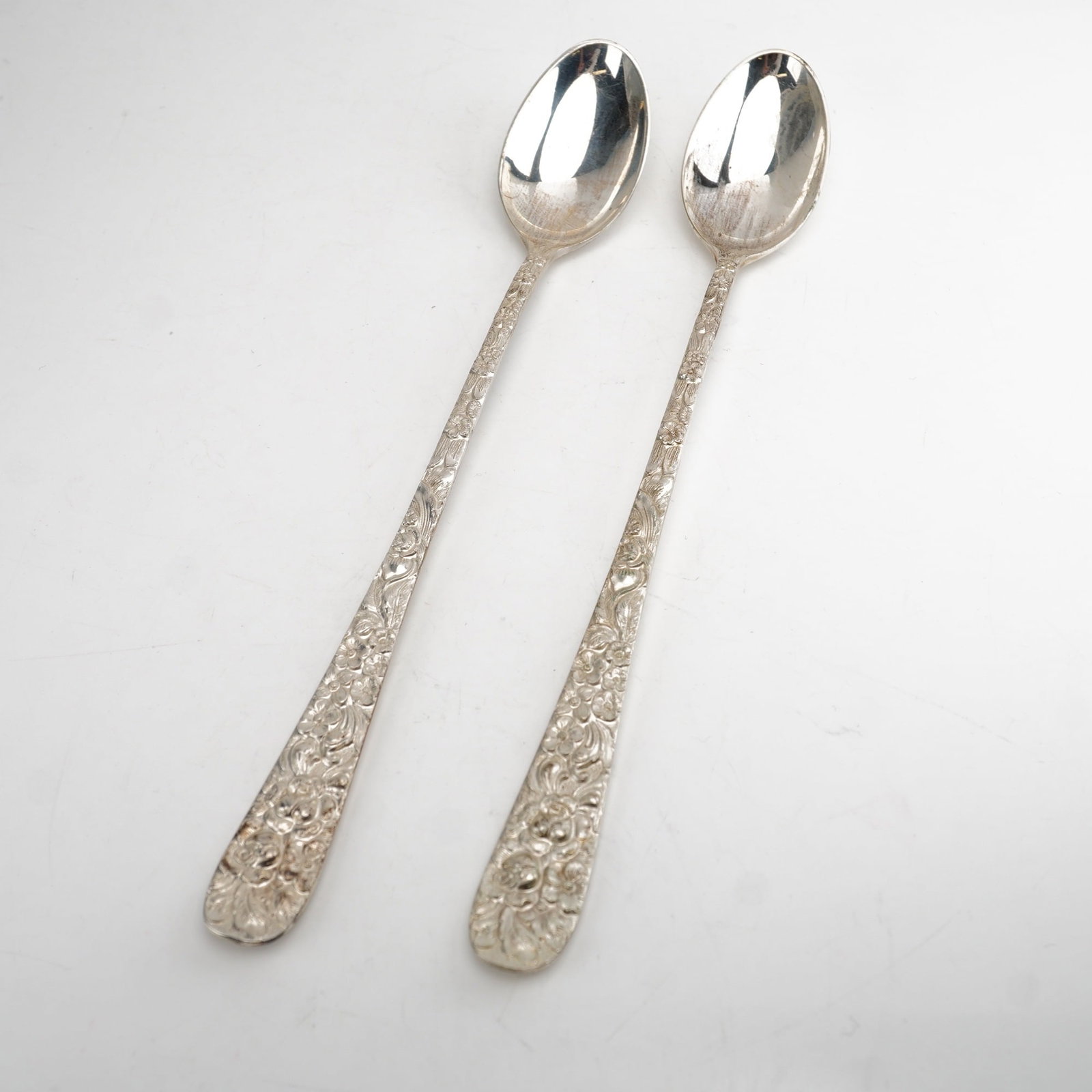 2pc Kirk Stieff Sterling Silver Iced Tea Spoons, Stieff Rose: Set includes two iced tea spoons in the historic Stieff Rose pattern by Kirk Stieff, first introduced in 1892. Each spoon displays an intricately crafted sterling silver handle featuring elaborate