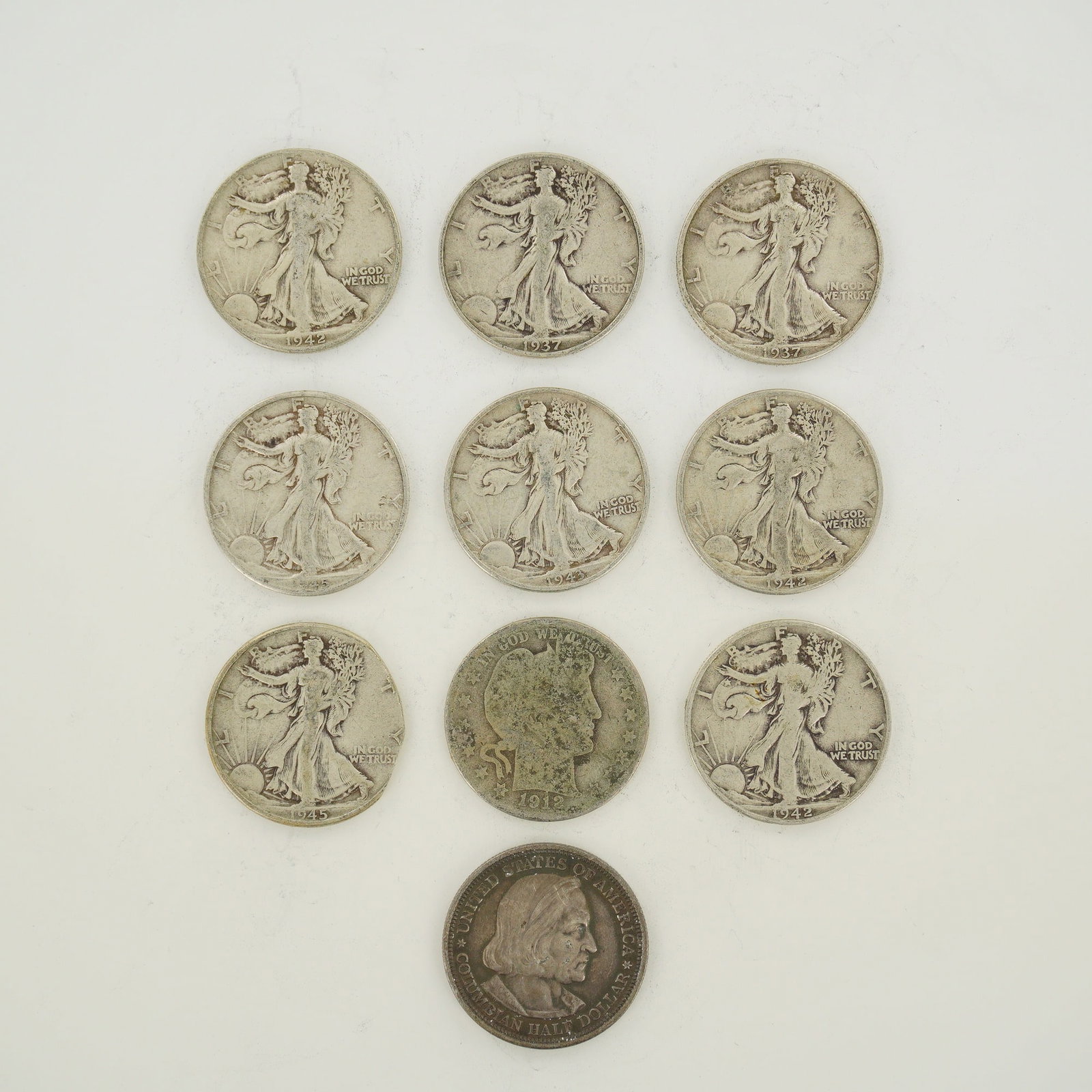 A Collection of Ten US 90% Silver Half Dollars Including Walking Liberty, Barber, and Columbian (1 of 2)
