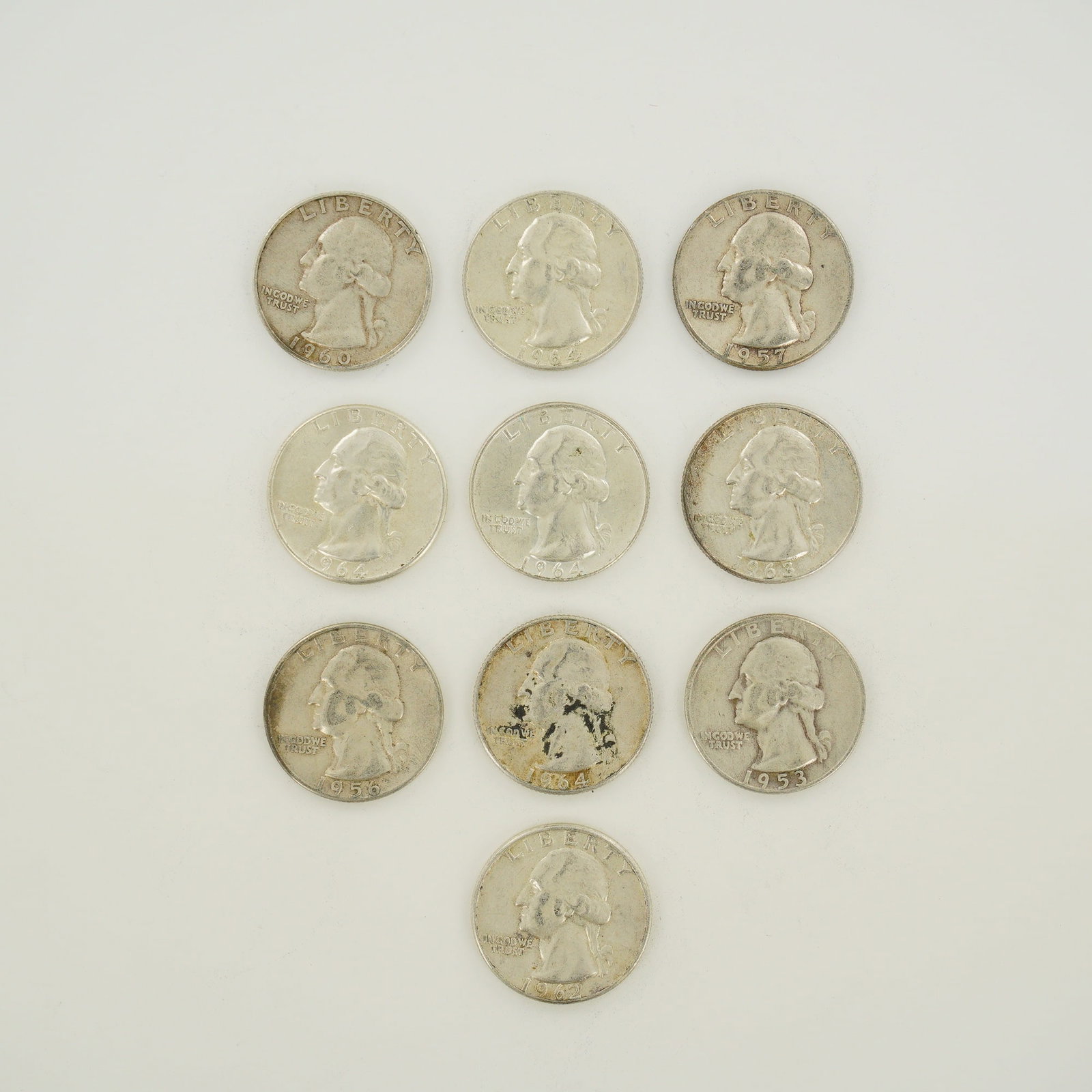 10pc Collection of US 90% Silver Washington Quarters Mixed Dates, 1953-1964: A collection of US 90% silver Washington quarters featuring mixed dates. This mixed date bag of coinage includes various dates spanning 1953 to 1964. The assortment contains specimens from the Denver