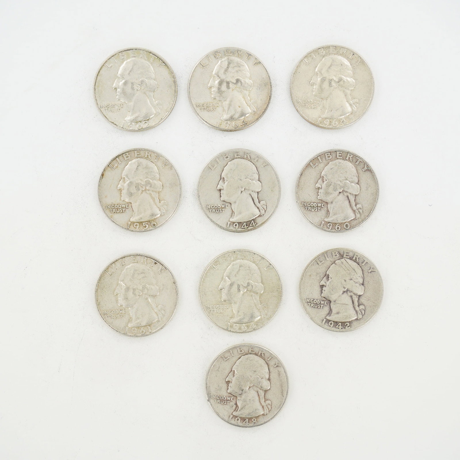 10pc Pre-1964 U.S. 90% Silver Washington Quarters: This collection consists of US Washington quarters struck in 90% silver, representing a mixed date bag of coins issued between 1942 and 1964. The assortment includes specimens with dates 1942, 1944,