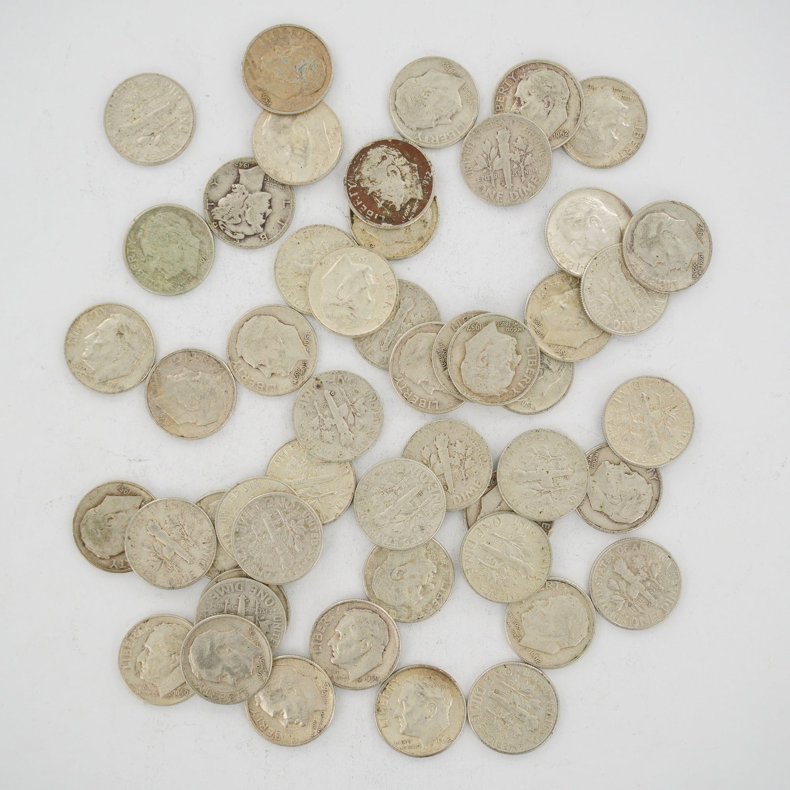 A Collection of US 90% Silver Dimes, Mixed Date Bag: This mixed date bag of US 90% silver coins consists of Roosevelt and Winged Liberty Head (Mercury) dimes minted pre-1965. Confirmed dates within the group include 1942, 1952, 1954, 1957, 1958, 1959, 1