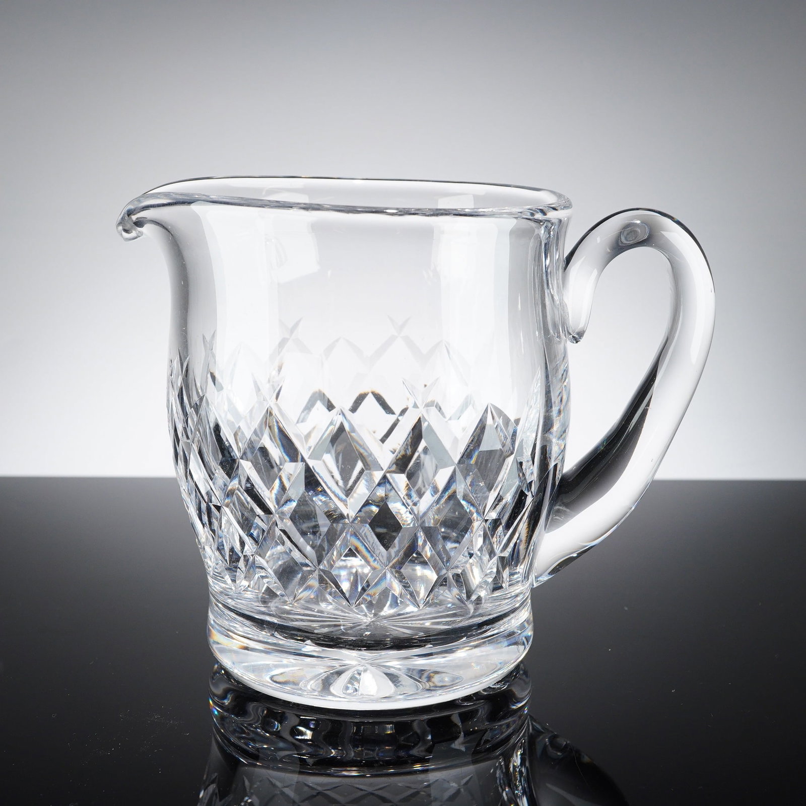 Waterford Boyne Pattern Crystal Cream Jug: This is a professional lead crystal cream jug or small pitcher manufactured by Waterford. The vessel features the Boyne pattern, which is characterized by a deep-cut diamond lattice design on the lowe