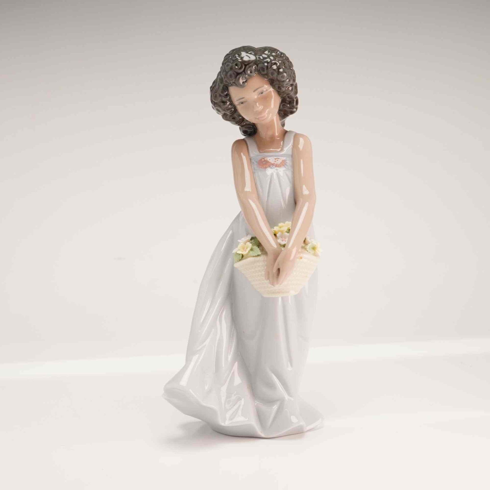 Lladro Porcelain Figurine 01006471 My Pretty Flowers with Original Box: This glazed porcelain figurine, titled My Pretty Flowers, is manufactured by Lladro in Valencia, Spain. Designed by sculptor Joan Coderch and first issued in 1998, this piece is identified as model nu