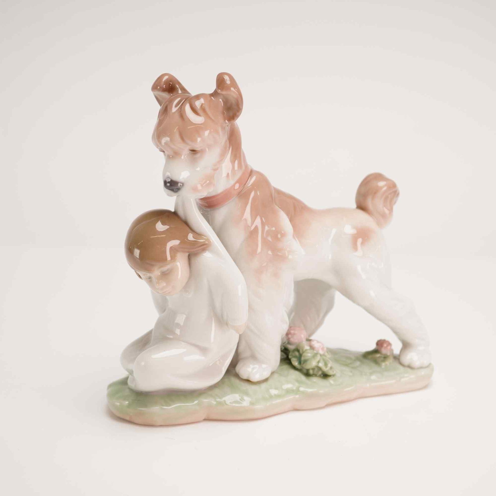 Lladro Porcelain Figurine Safe and Sound 01006556 with Box: A Lladro glazed porcelain figurine titled Safe and Sound, model number 6556 (also identified by the reference 01006556). The piece depicts a young girl in a white nightgown kneeling on a pale green gr
