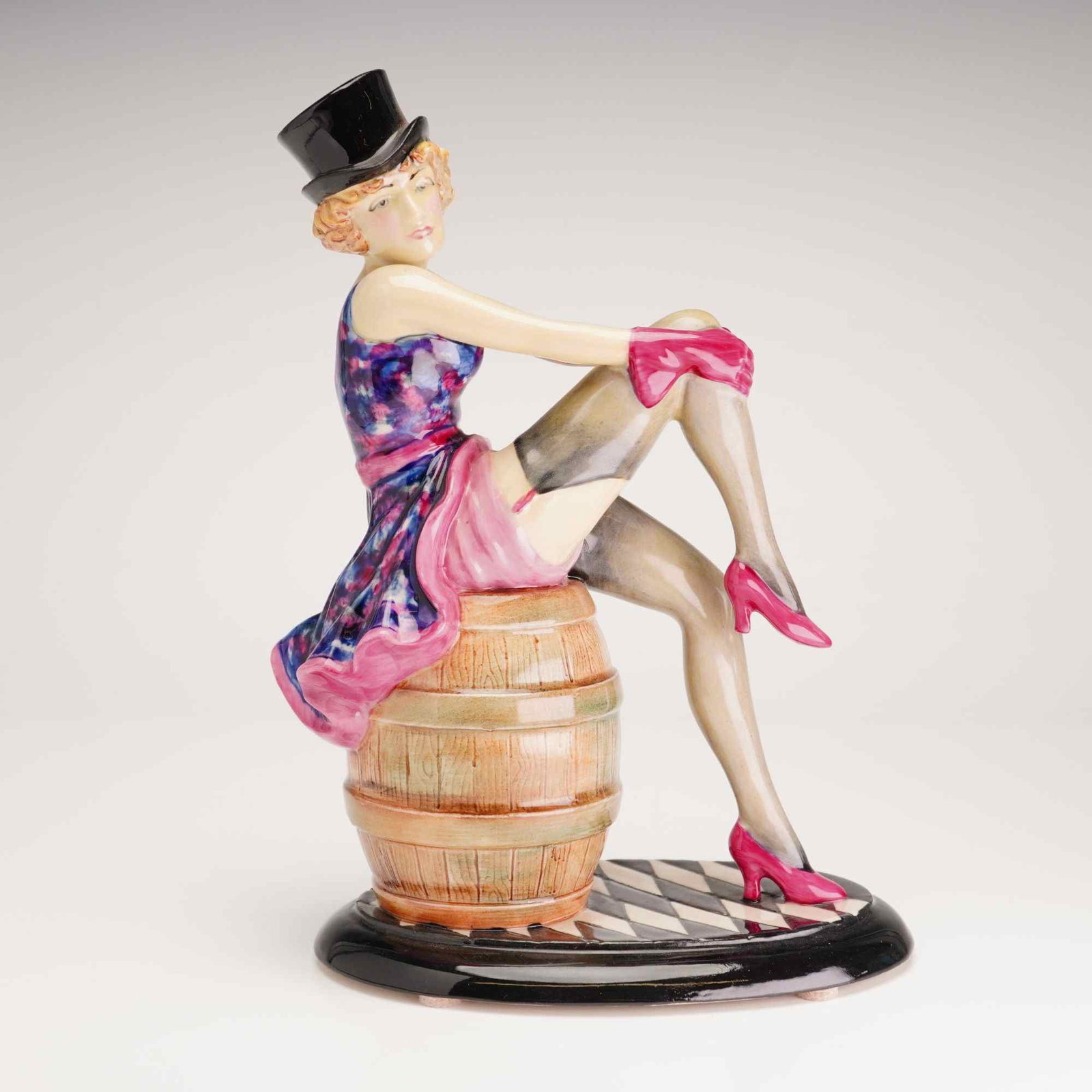 Kevin Francis Ceramic Limited Edition Figurine, Marlene Dietrich: A hand-painted glazed ceramic figurine depicting actress Marlene Dietrich in a cabaret-style pose, produced by Peggy Davies Ceramics for Kevin Francis. The figure is shown wearing a black top hat, a f