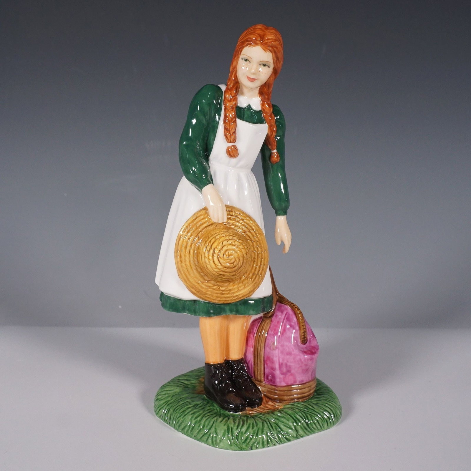 Royal Doulton Figurine, Anne Arrives at Green Gables HN5225: A charming addition to the Anne of Green Gables series, this Royal Doulton figurine beautifully portrays the iconic character Anne as she embarks on her new life at Green Gables. Designed by Nada Pedl