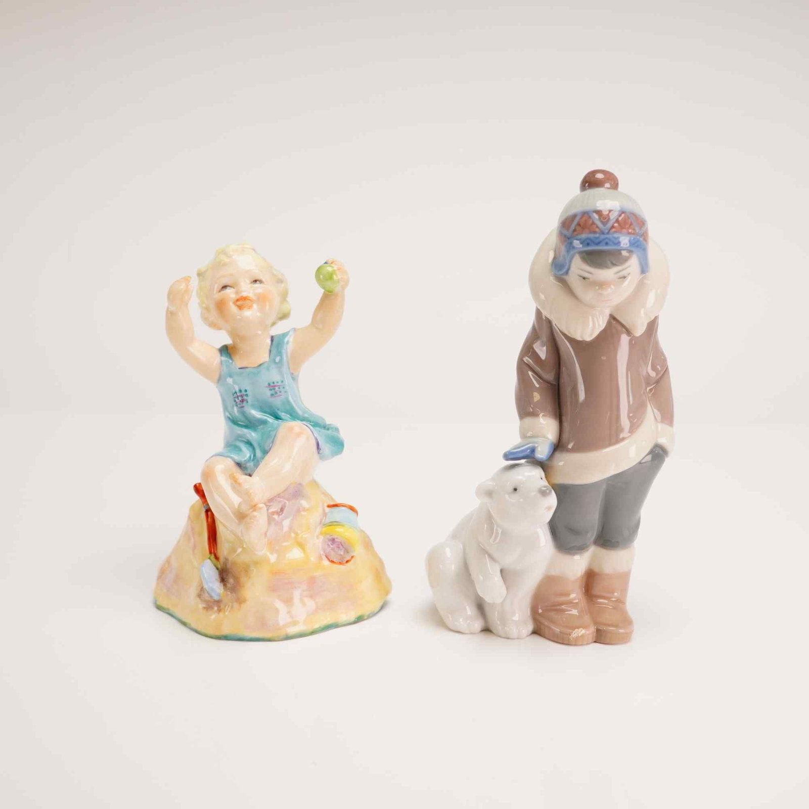 Two Porcelain Figurines Including Lladro Eskimo Boy with Pet and Royal Worcester Sunday's Child (1 of 4)