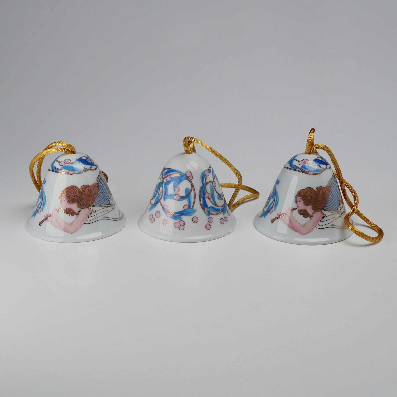 3pc 2003 Lladro Porcelain Christmas Bell Ornaments: This set of three porcelain Christmas bell ornaments was produced by Lladro in 2003. The group consists of two bells in the Angelic Melody pattern and one bell in the Mistletoe pattern. Each ornament 
